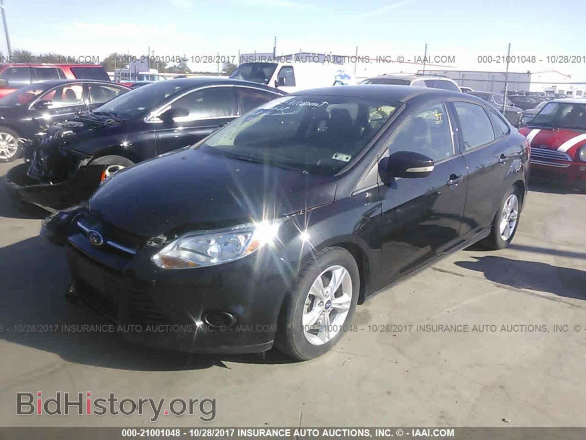 2014 Ford Focus - VIN: 1FADP3F20EL310975 - Photo 2
