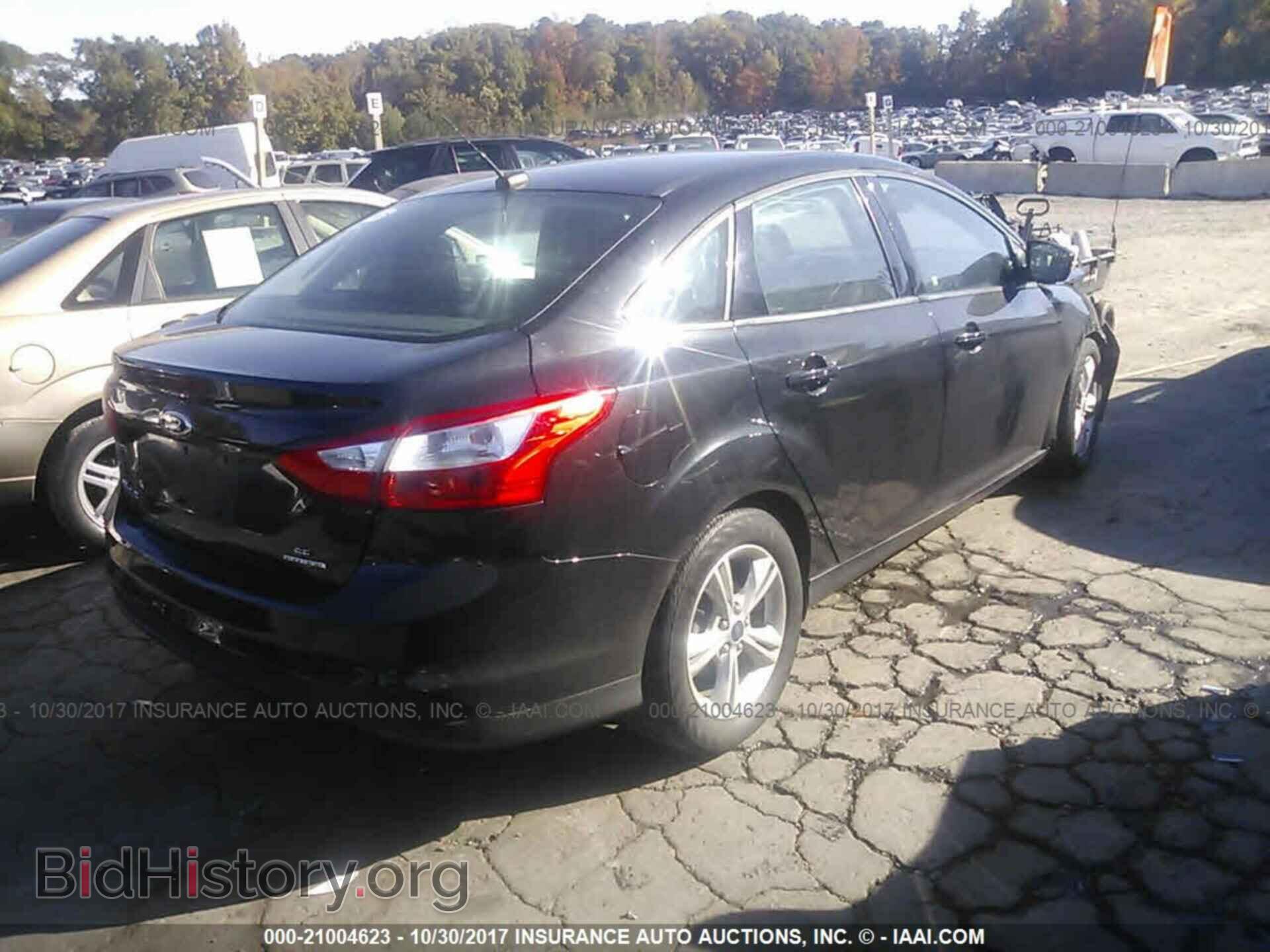 2014 Ford Focus - VIN: 1FADP3F20EL228566 - Photo 4