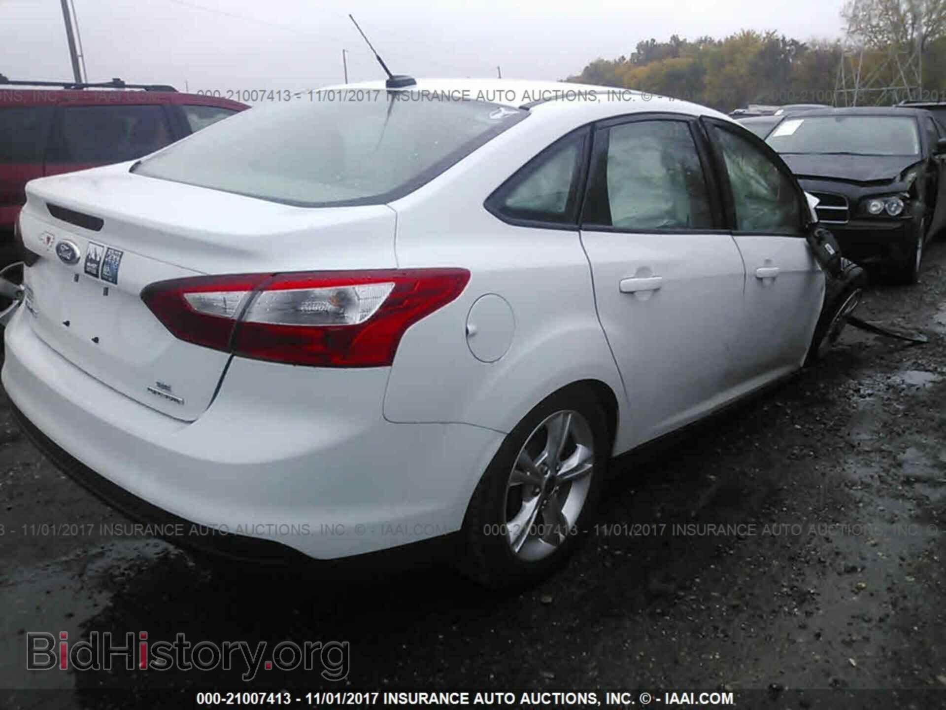2014 Ford Focus - VIN: 1FADP3F24EL373318 - Photo 4