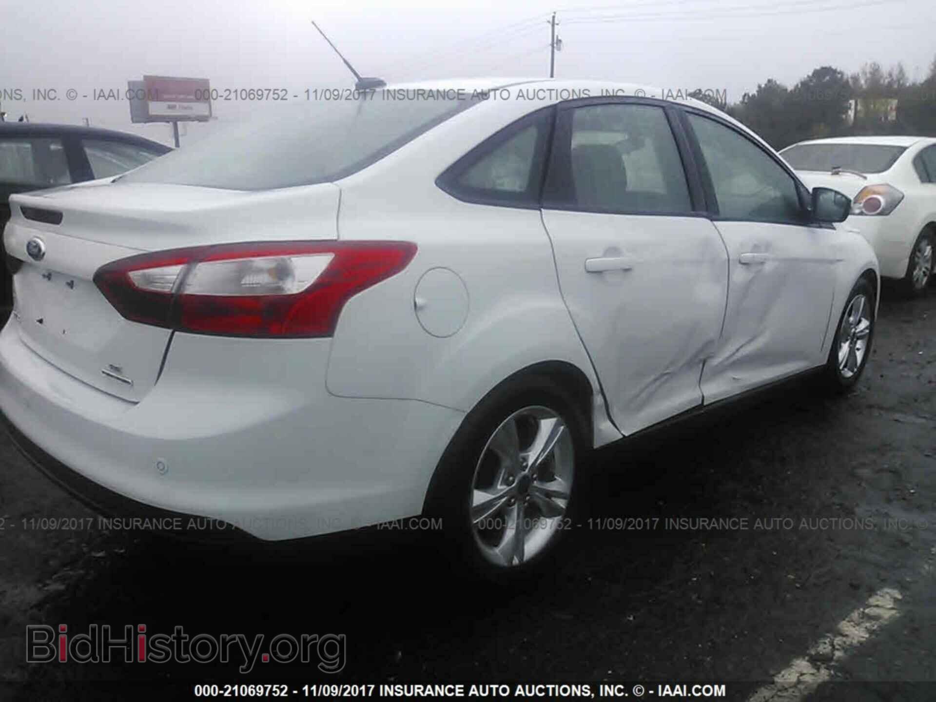 2014 Ford Focus - VIN: 1FADP3F21EL227328 - Photo 4