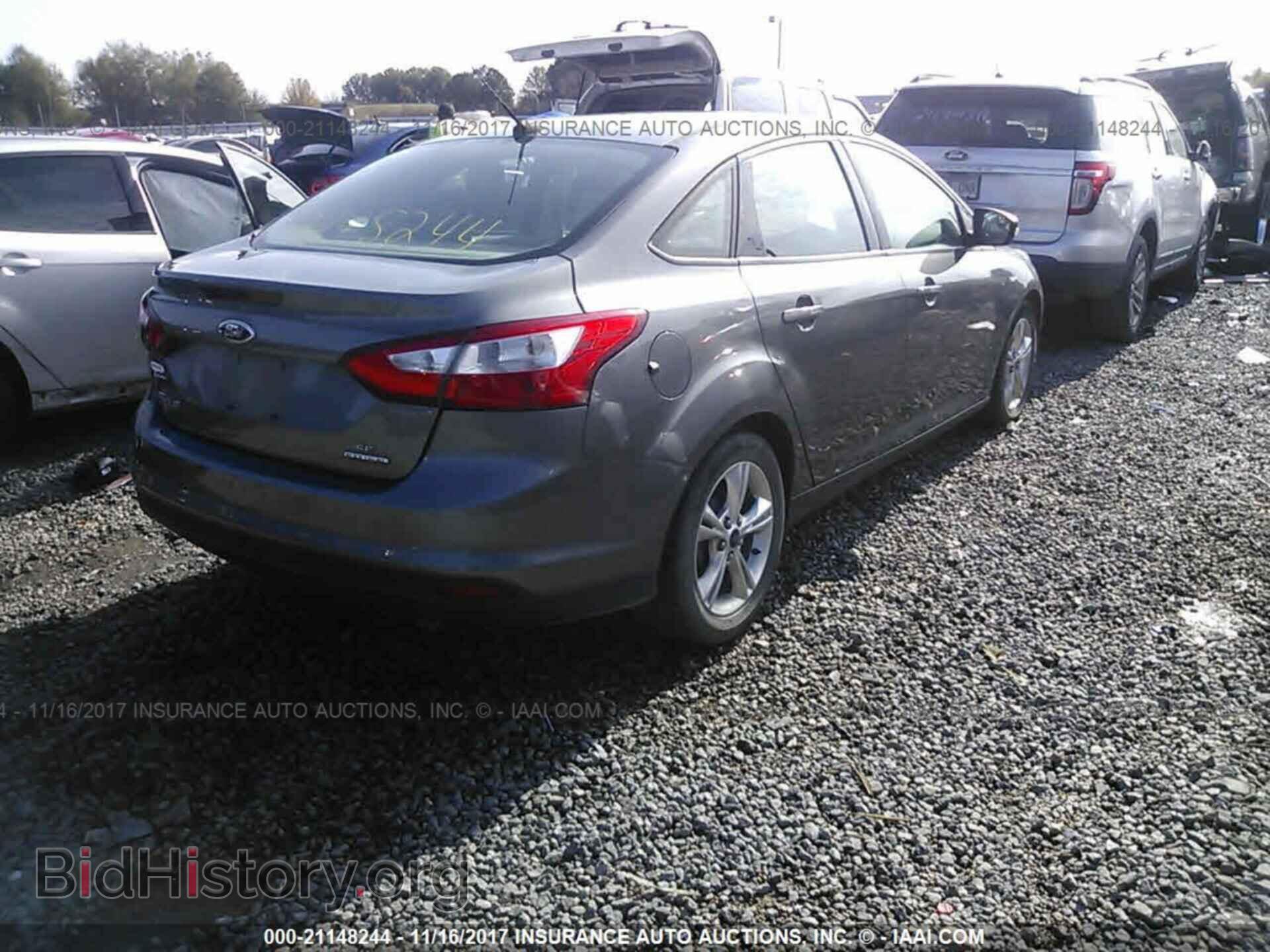 2014 Ford Focus - VIN: 1FADP3F21EL219858 - Фото 4