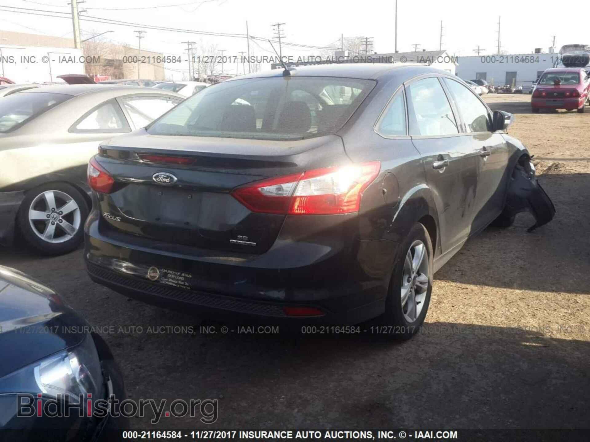 2014 Ford Focus - VIN: 1FADP3F26EL207558 - Photo 4