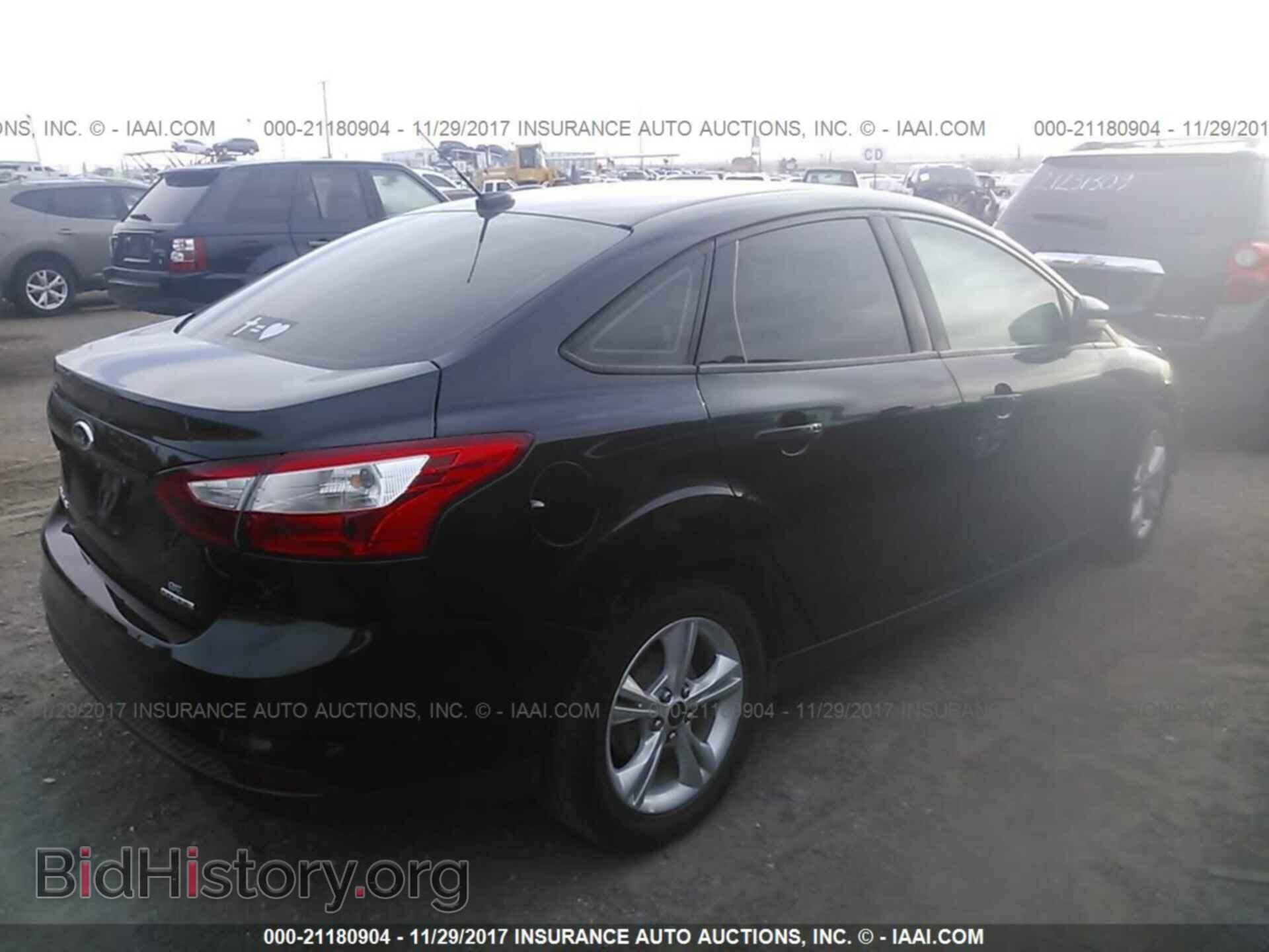 2014 Ford Focus - VIN: 1FADP3F20EL117600 - Photo 4