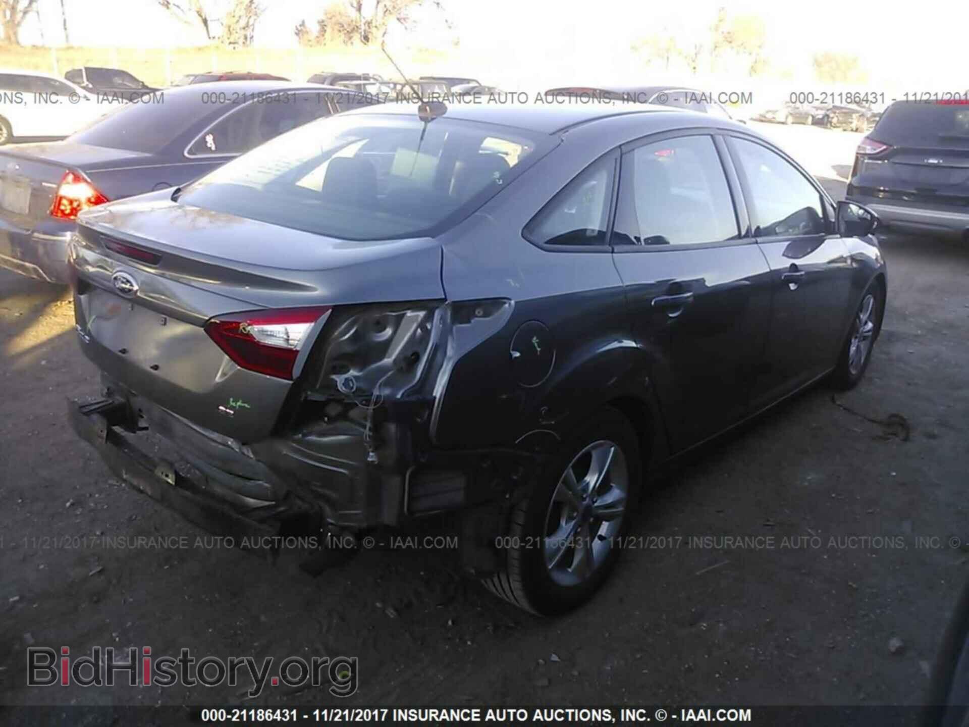 2014 Ford Focus - VIN: 1FADP3F29EL102058 - Фото 4
