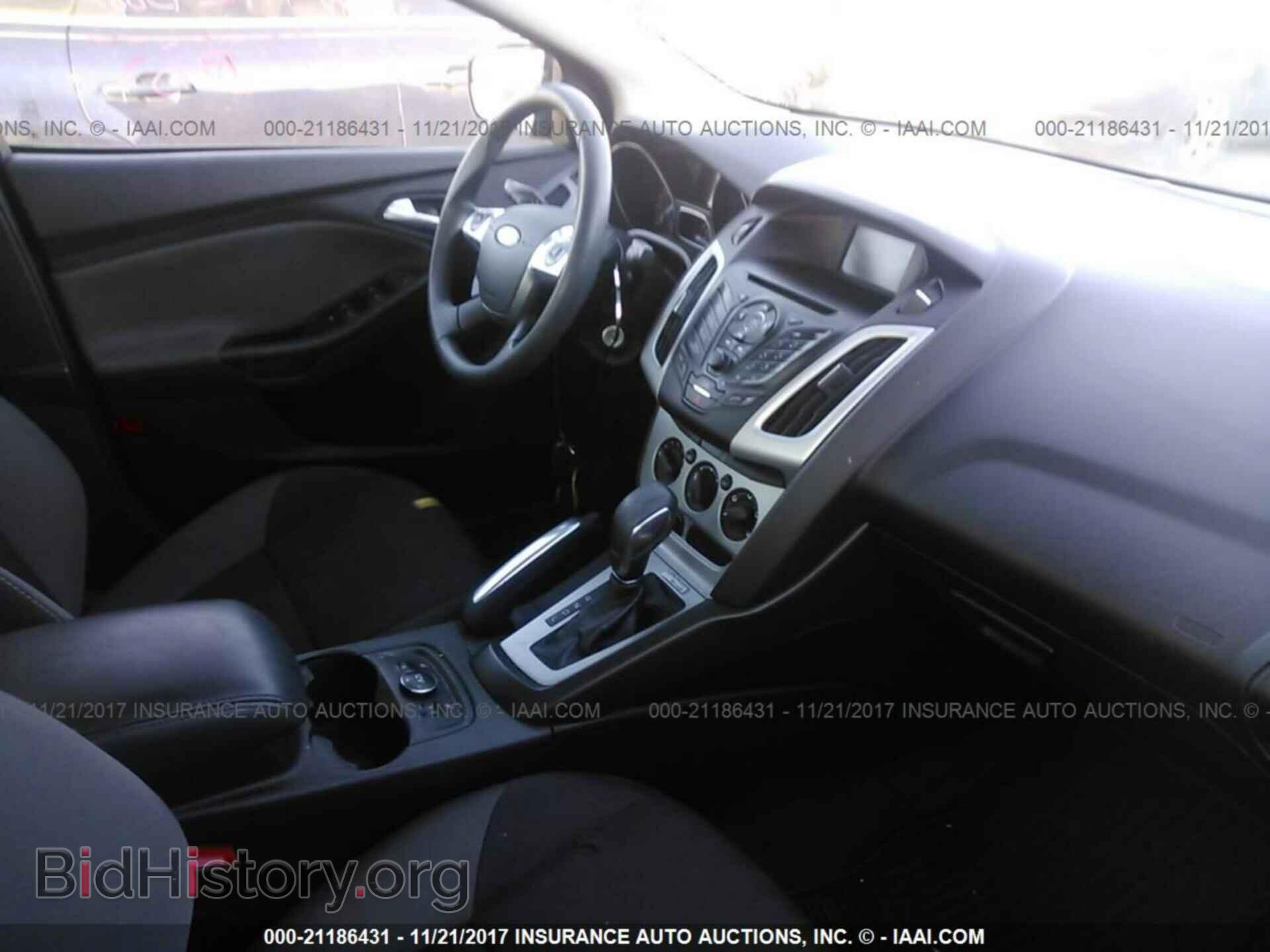 2014 Ford Focus - VIN: 1FADP3F29EL102058 - Фото 5