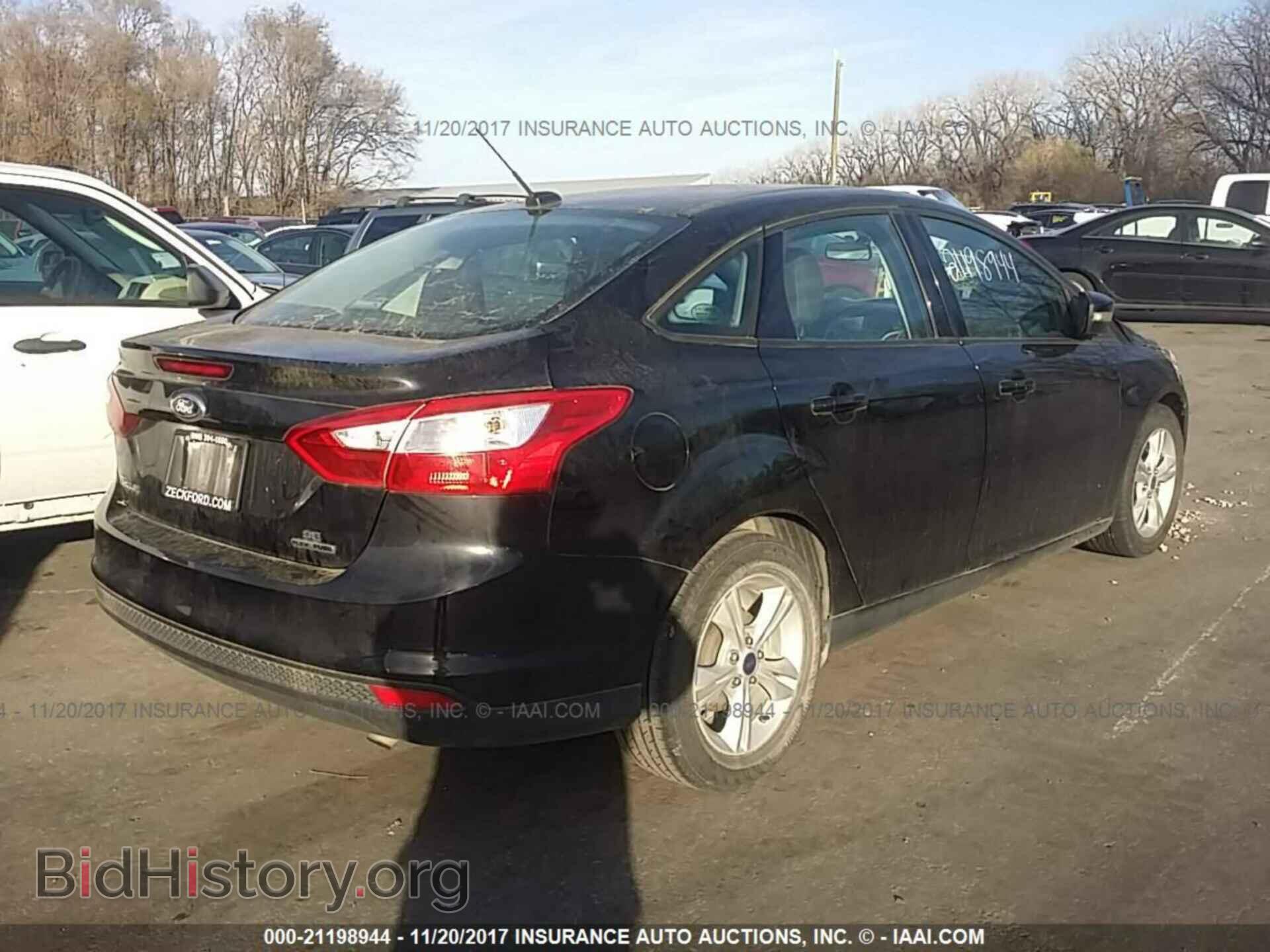 2014 Ford Focus - VIN: 1FADP3F25EL404138 - Фото 4