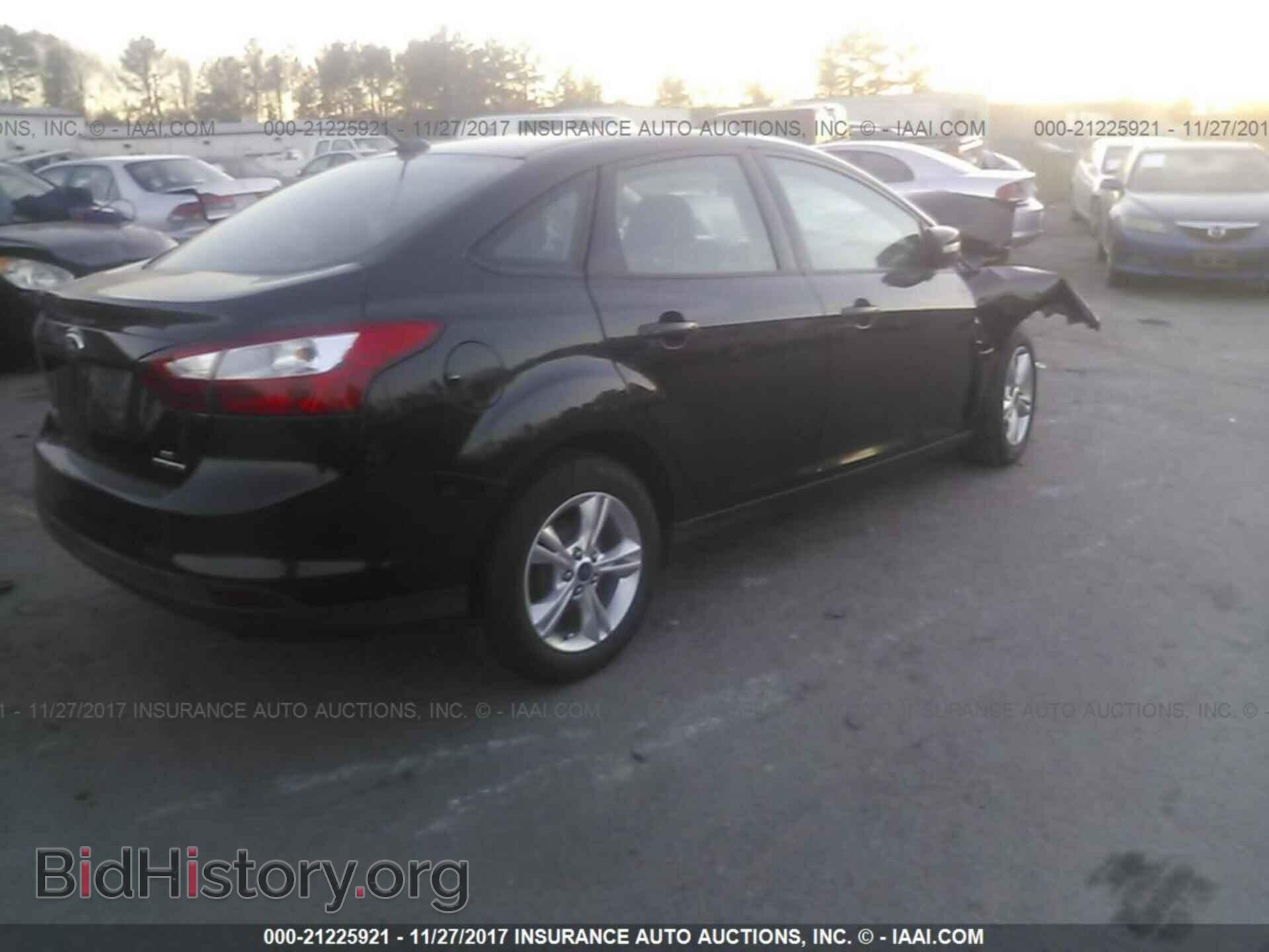 2014 Ford Focus - VIN: 1FADP3F25EL267749 - Фото 4