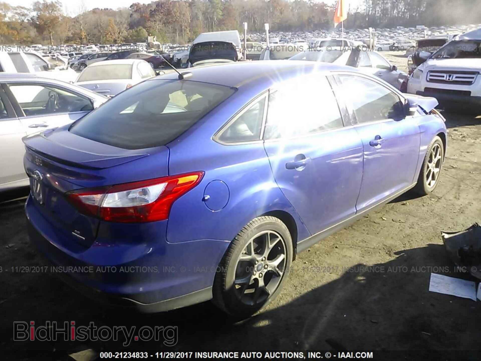 2014 Ford Focus - VIN: 1FADP3F24EL345079 - Photo 4