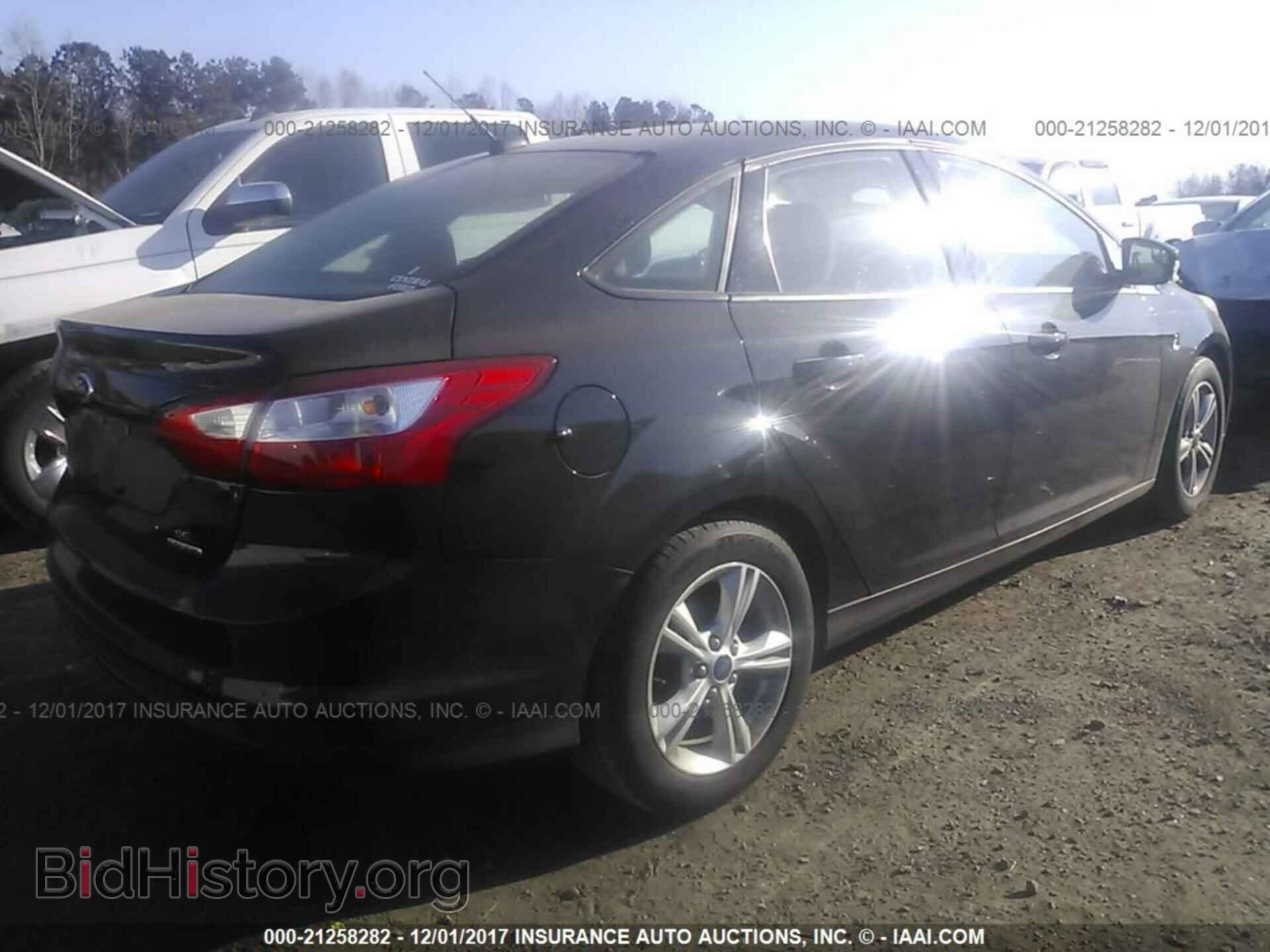 2014 Ford Focus - VIN: 1FADP3F25EL421599 - Photo 4