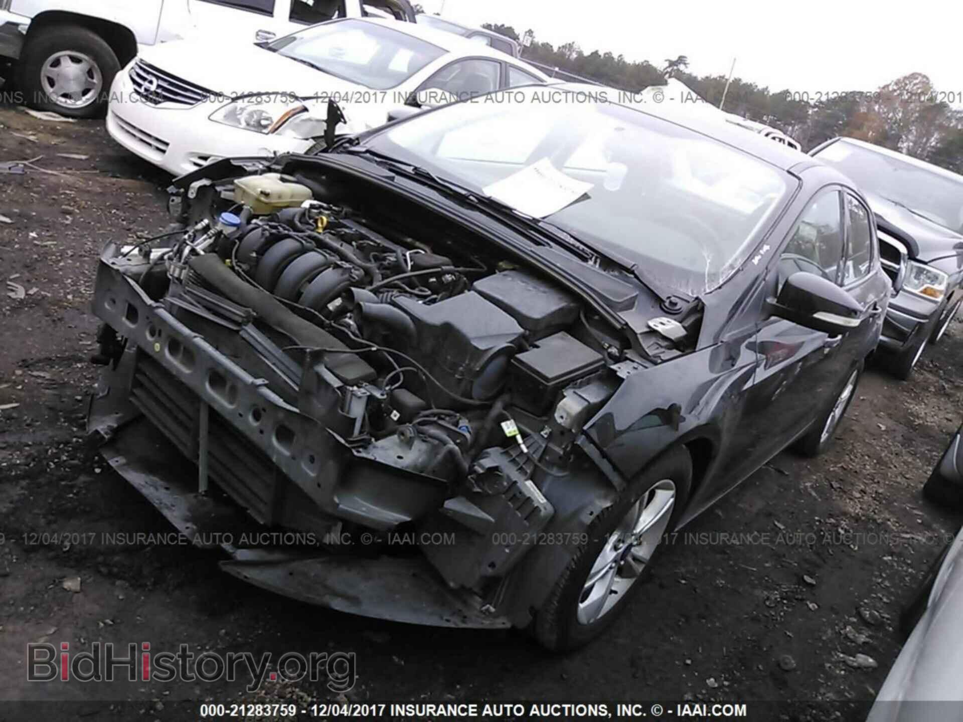 2014 Ford Focus - VIN: 1FADP3F20EL462593 - Фото 2
