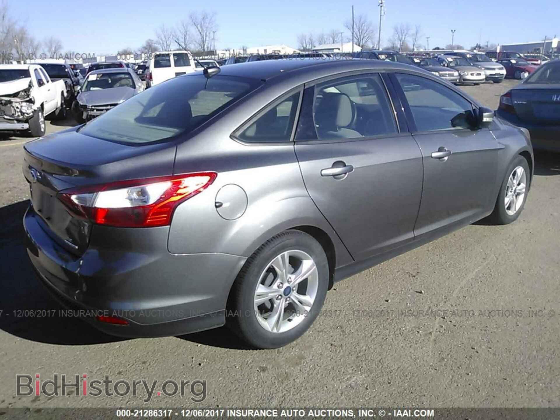 2014 Ford Focus - VIN: 1FADP3F28EL140557 - Фото 4