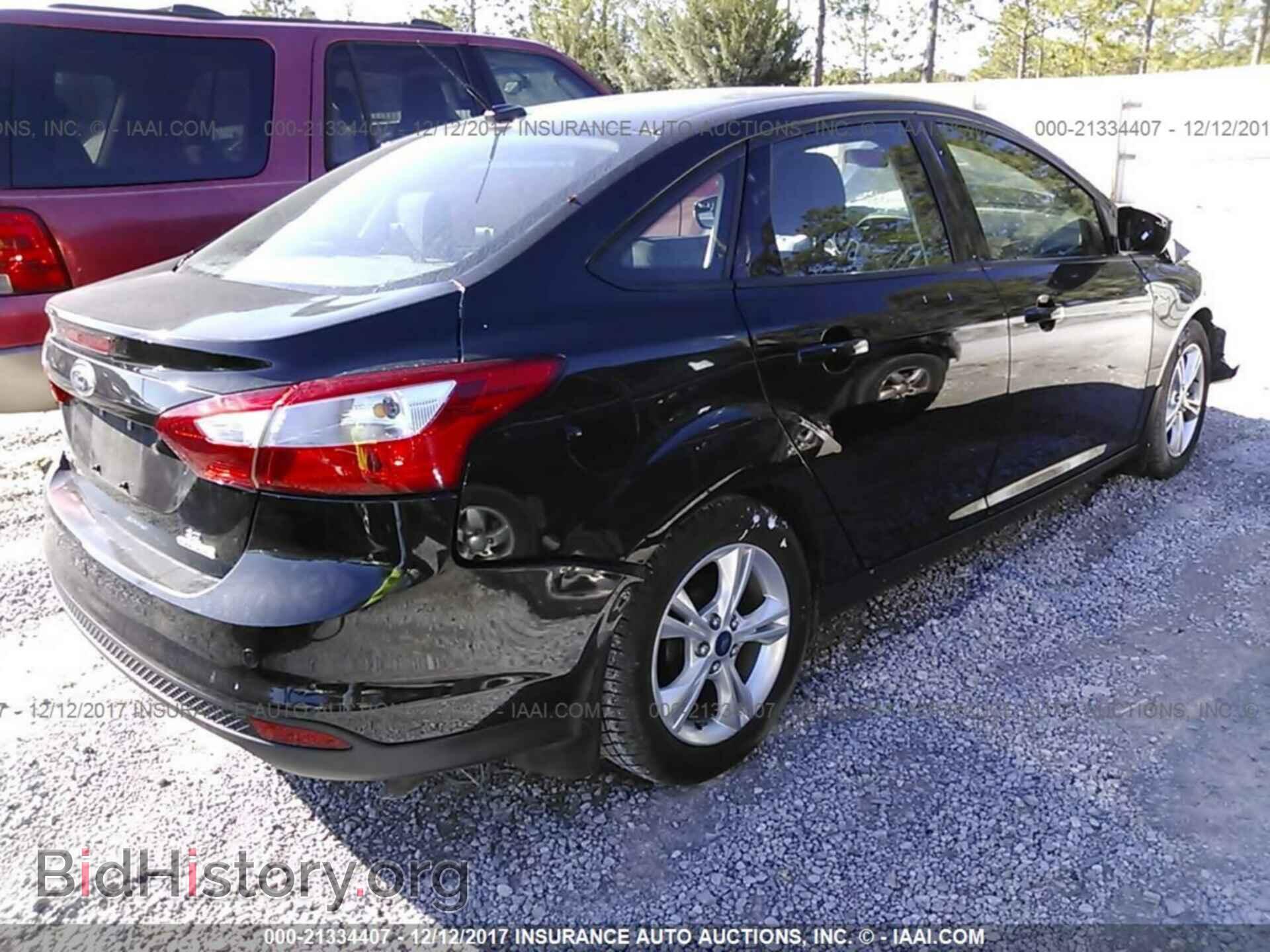 2014 Ford Focus - VIN: 1FADP3F24EL213858 - Photo 4