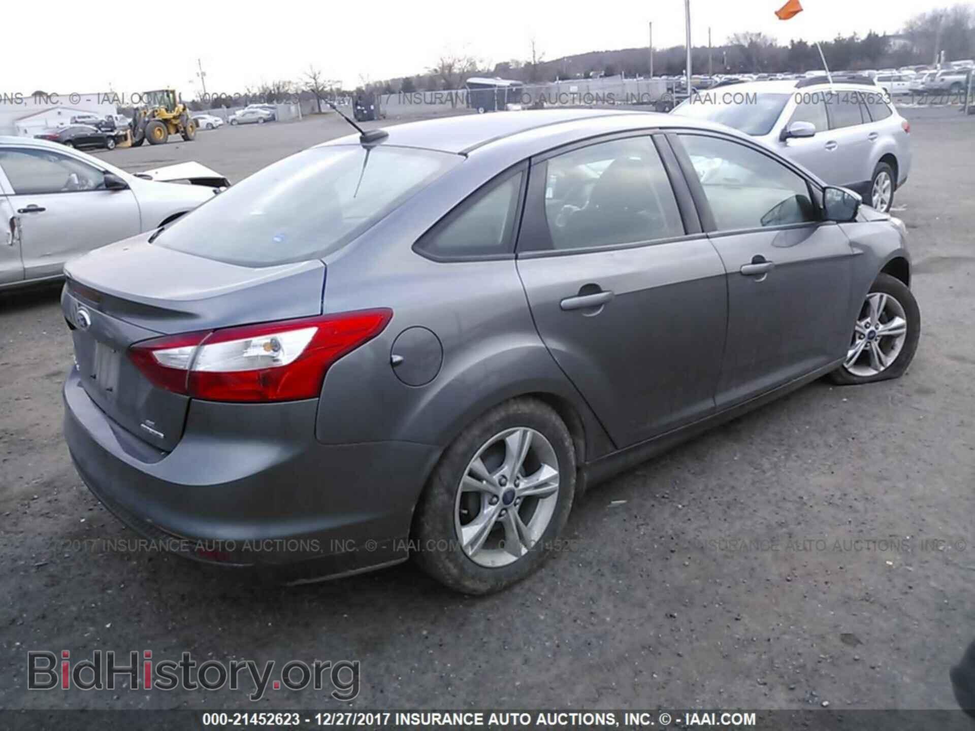2014 Ford Focus - VIN: 1FADP3F20EL157210 - Фото 4