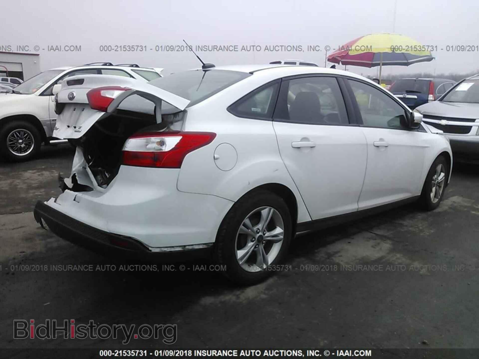 2013 Ford Focus - VIN: 1FADP3F28DL320877 - Photo 4