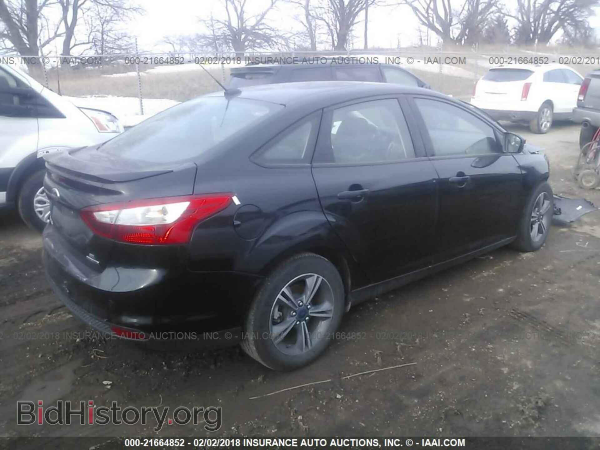 2014 Ford Focus - VIN: 1FADP3F23EL270858 - Photo 4