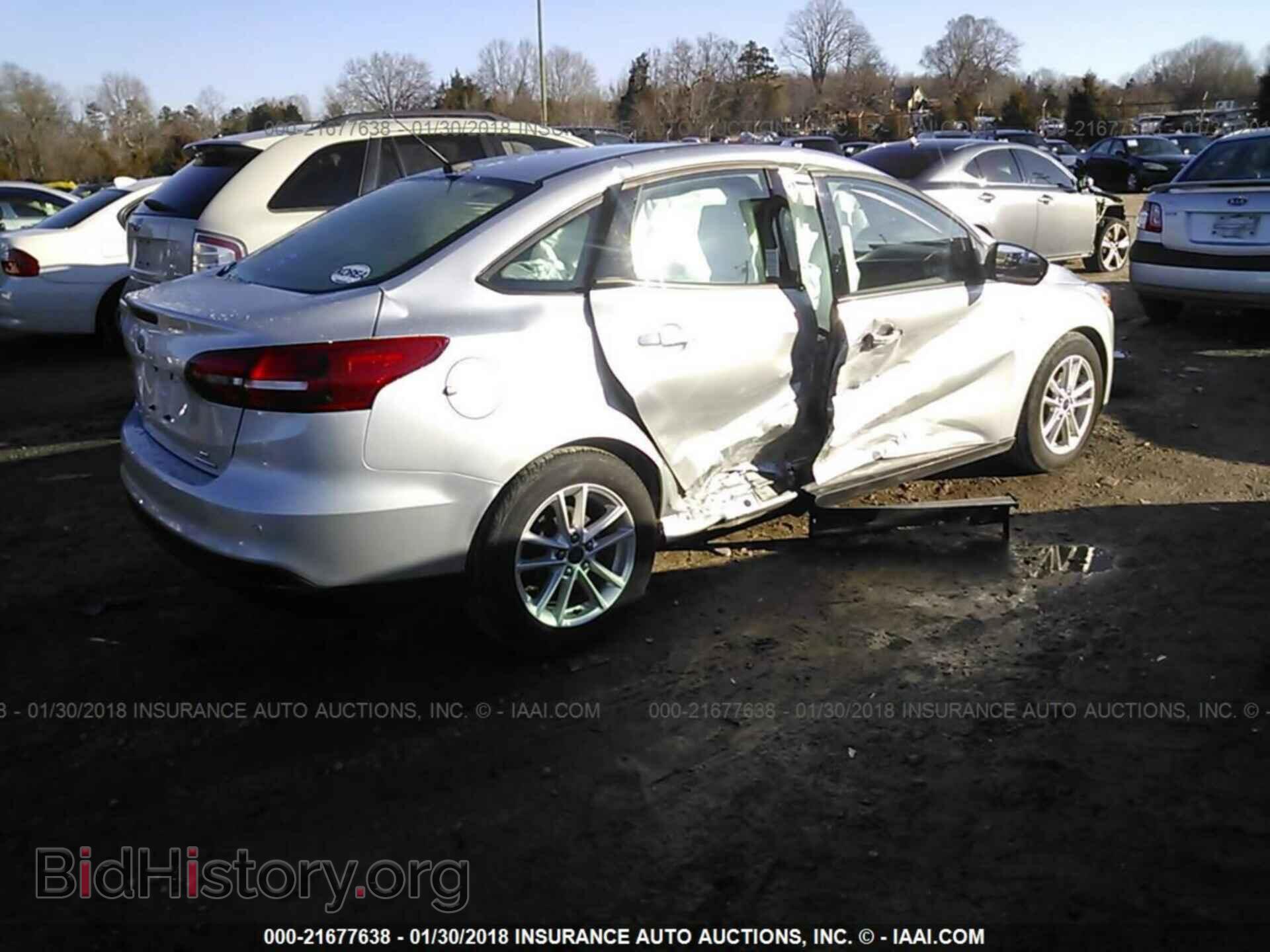 2015 Ford Focus - VIN: 1FADP3F20FL311058 - Photo 4