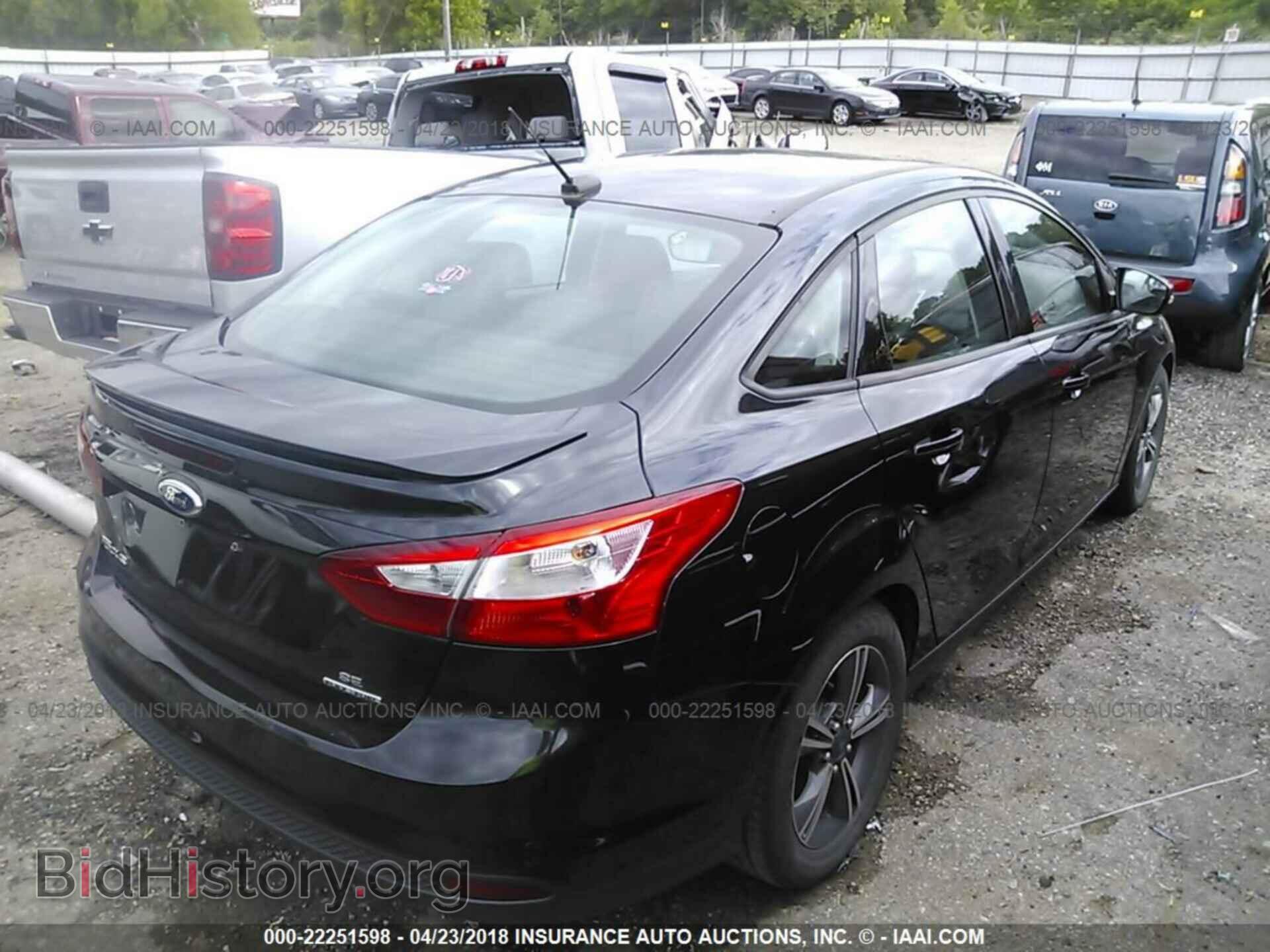 2014 Ford Focus - VIN: 1FADP3F21EL103625 - Photo 4