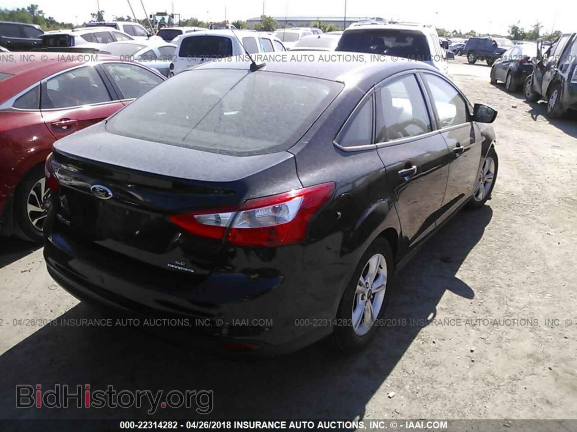 2014 Ford Focus - VIN: 1FADP3F23EL320741 - Photo 4
