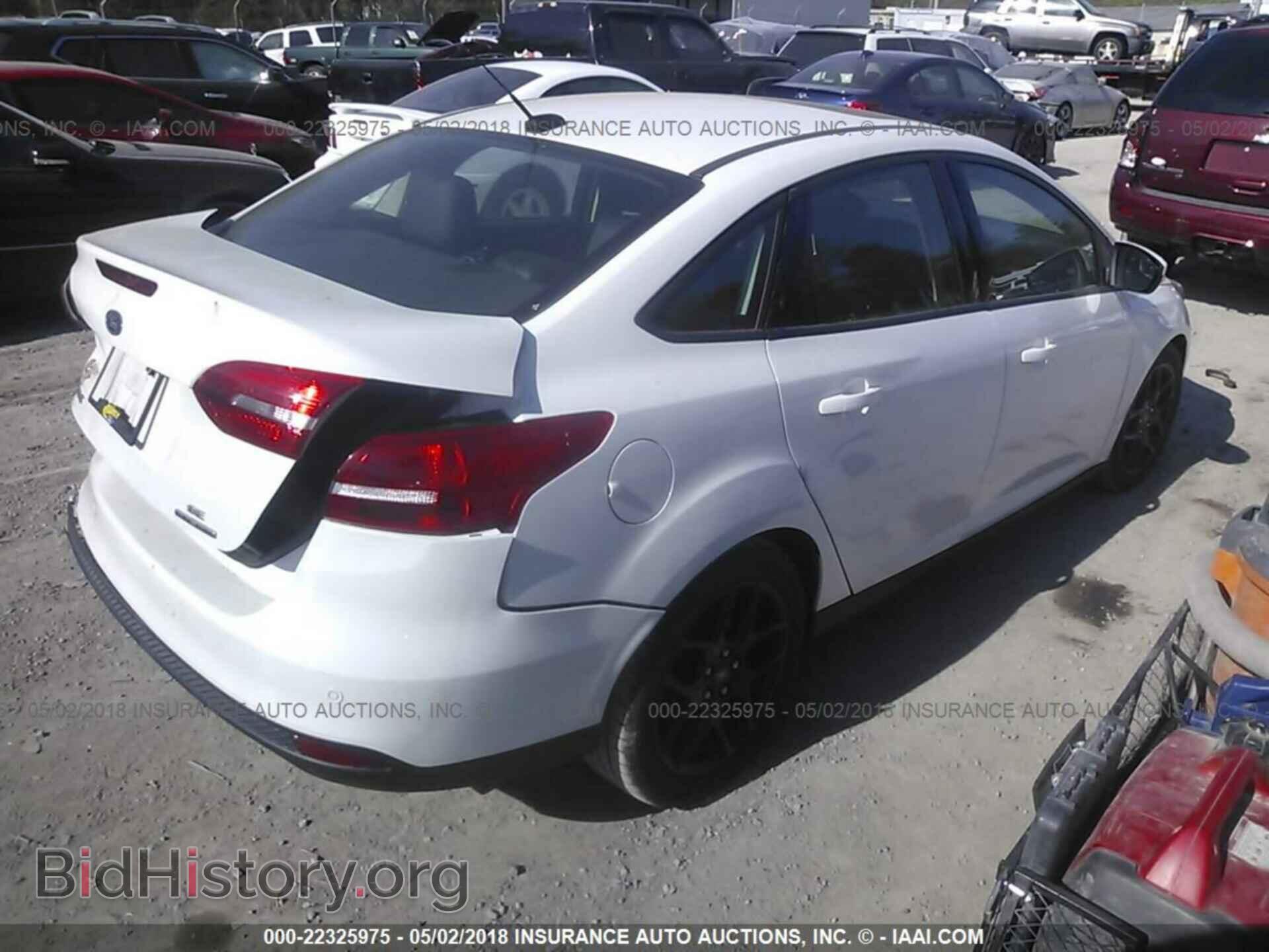 2016 Ford Focus - VIN: 1FADP3F29GL299011 - Photo 4