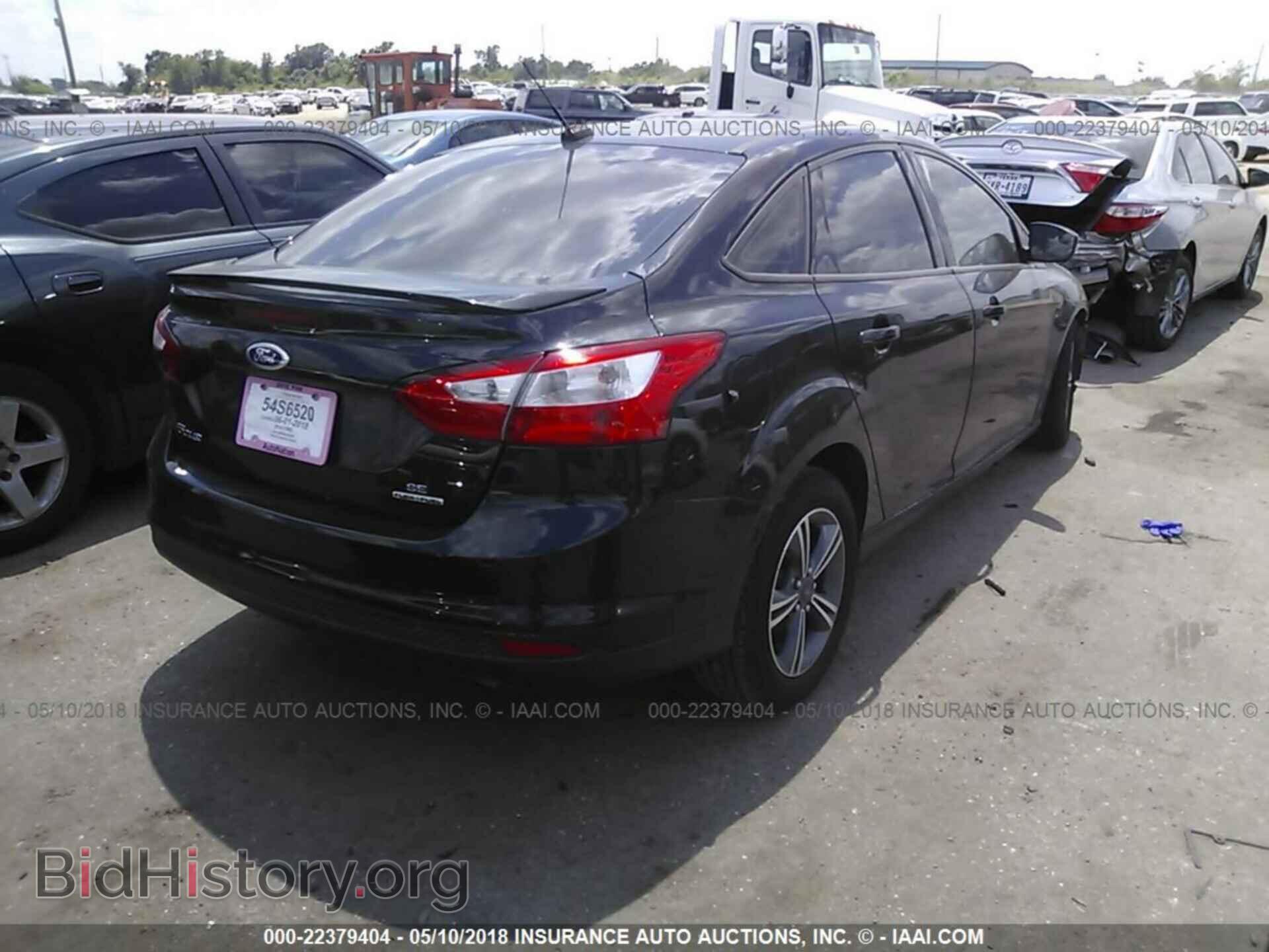 2014 Ford Focus - VIN: 1FADP3F20EL430159 - Фото 4