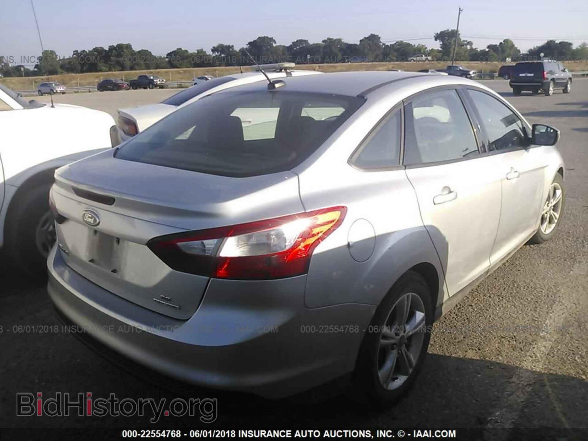 2014 Ford Focus - VIN: 1FADP3F21EL288338 - Фото 4