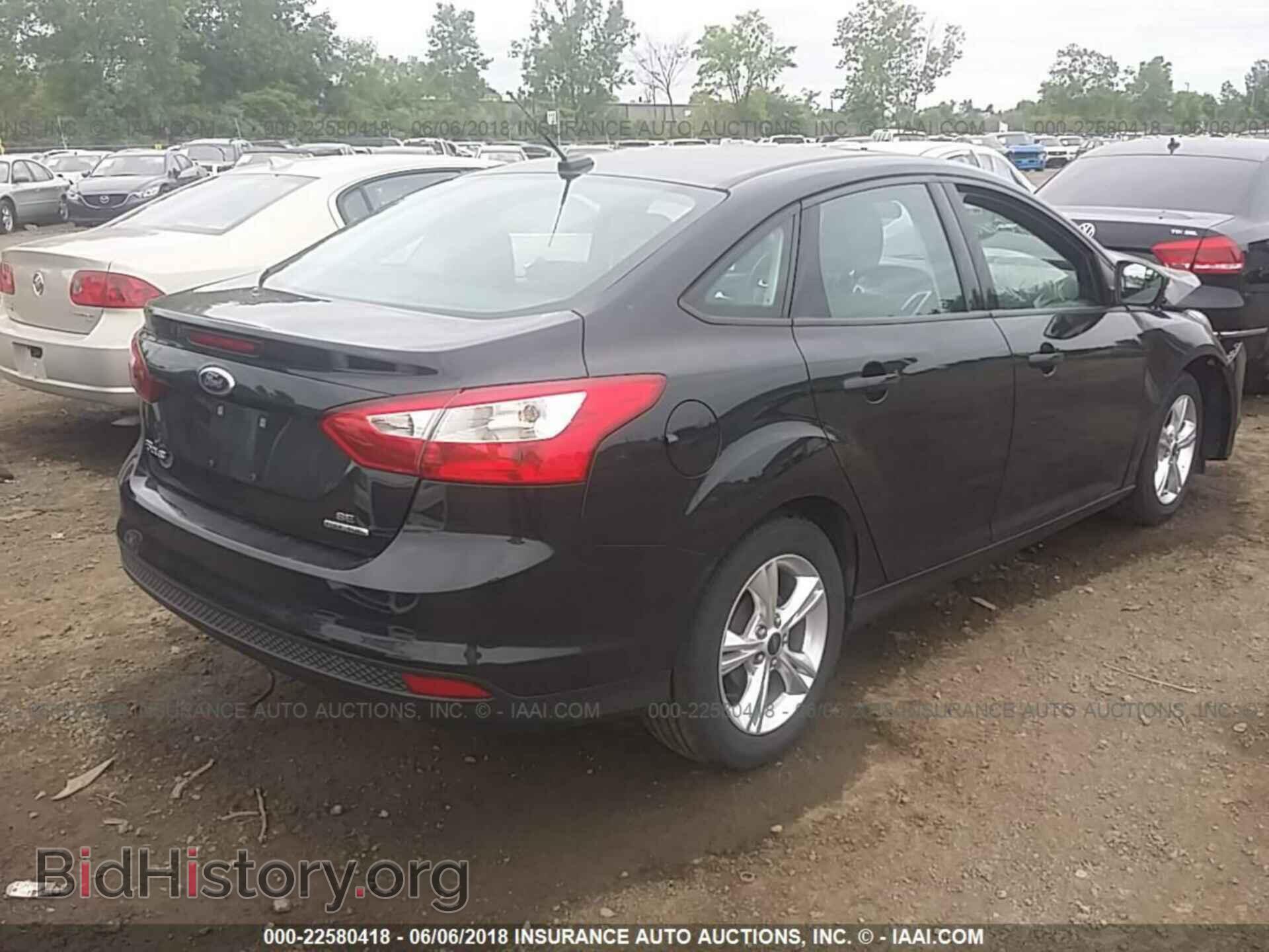 2014 Ford Focus - VIN: 1FADP3F20EL310359 - Фото 4