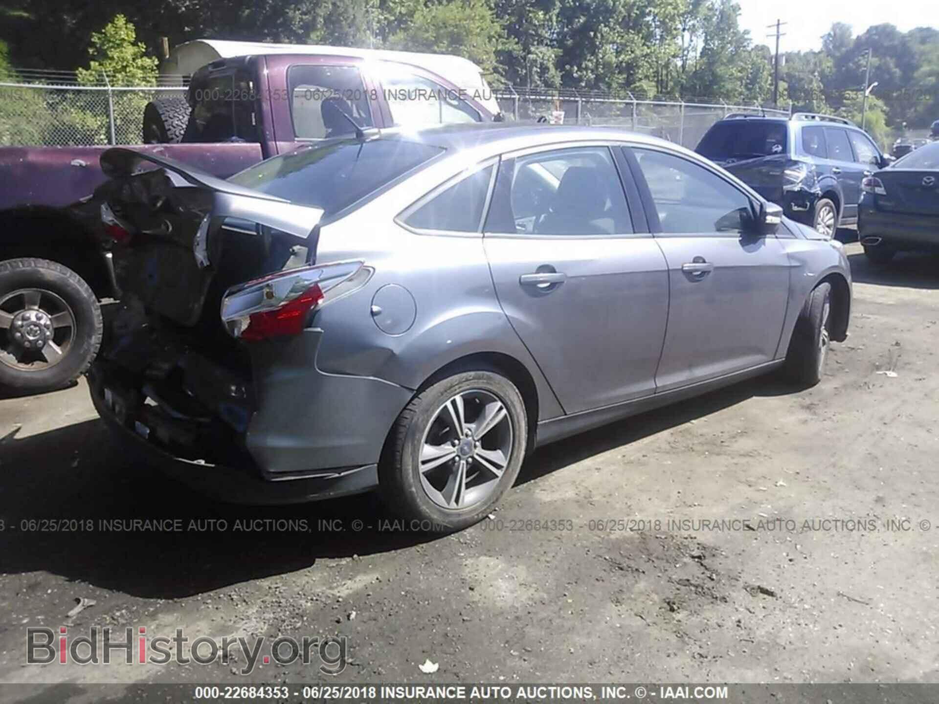 2014 Ford Focus - VIN: 1FADP3F2XEL309817 - Photo 4