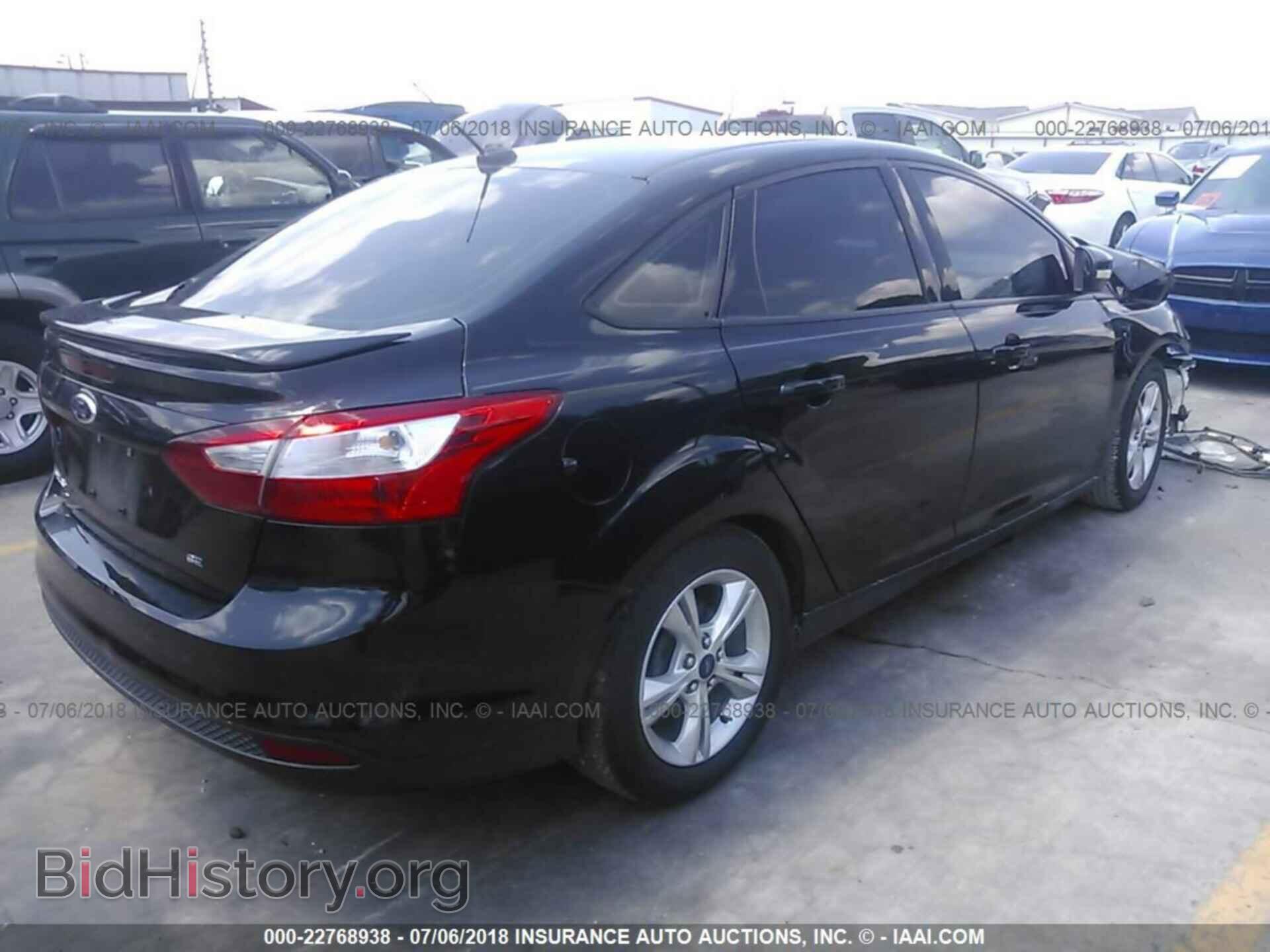 2014 Ford Focus - VIN: 1FADP3F28EL317494 - Фото 4