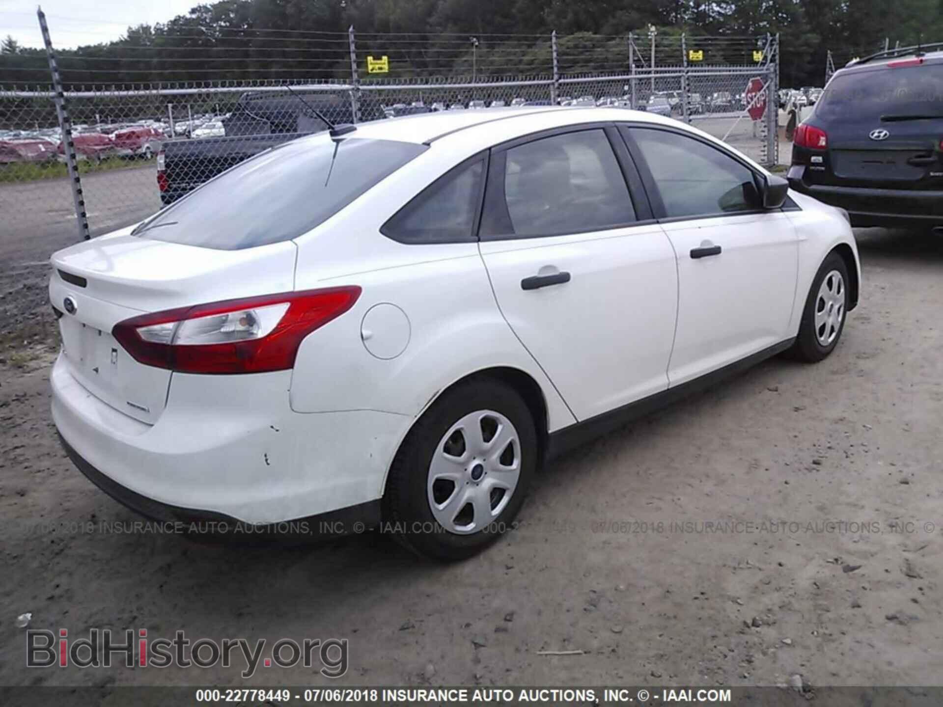 2014 Ford Focus - VIN: 1FADP3E23EL329358 - Фото 4