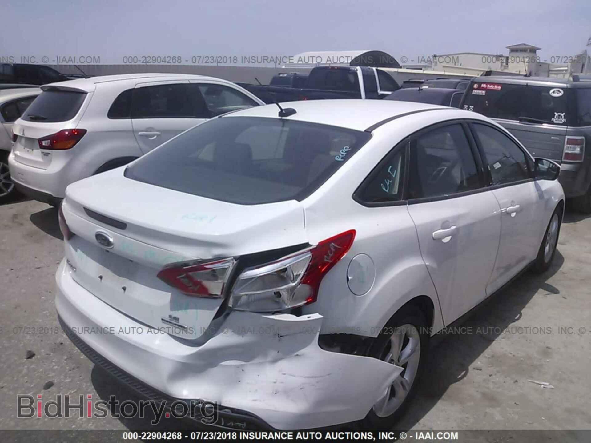 2014 Ford Focus - VIN: 1FADP3F23EL162899 - Photo 4