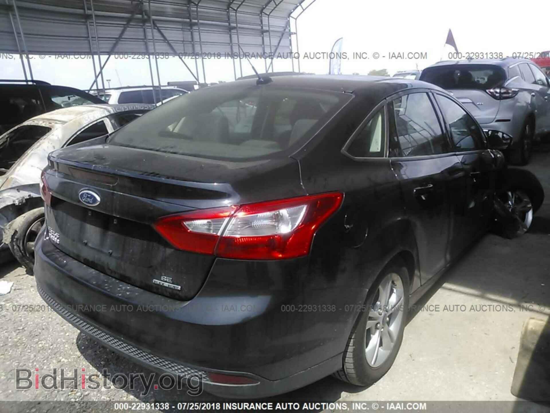 2014 Ford Focus - VIN: 1FADP3F26EL389617 - Фото 4