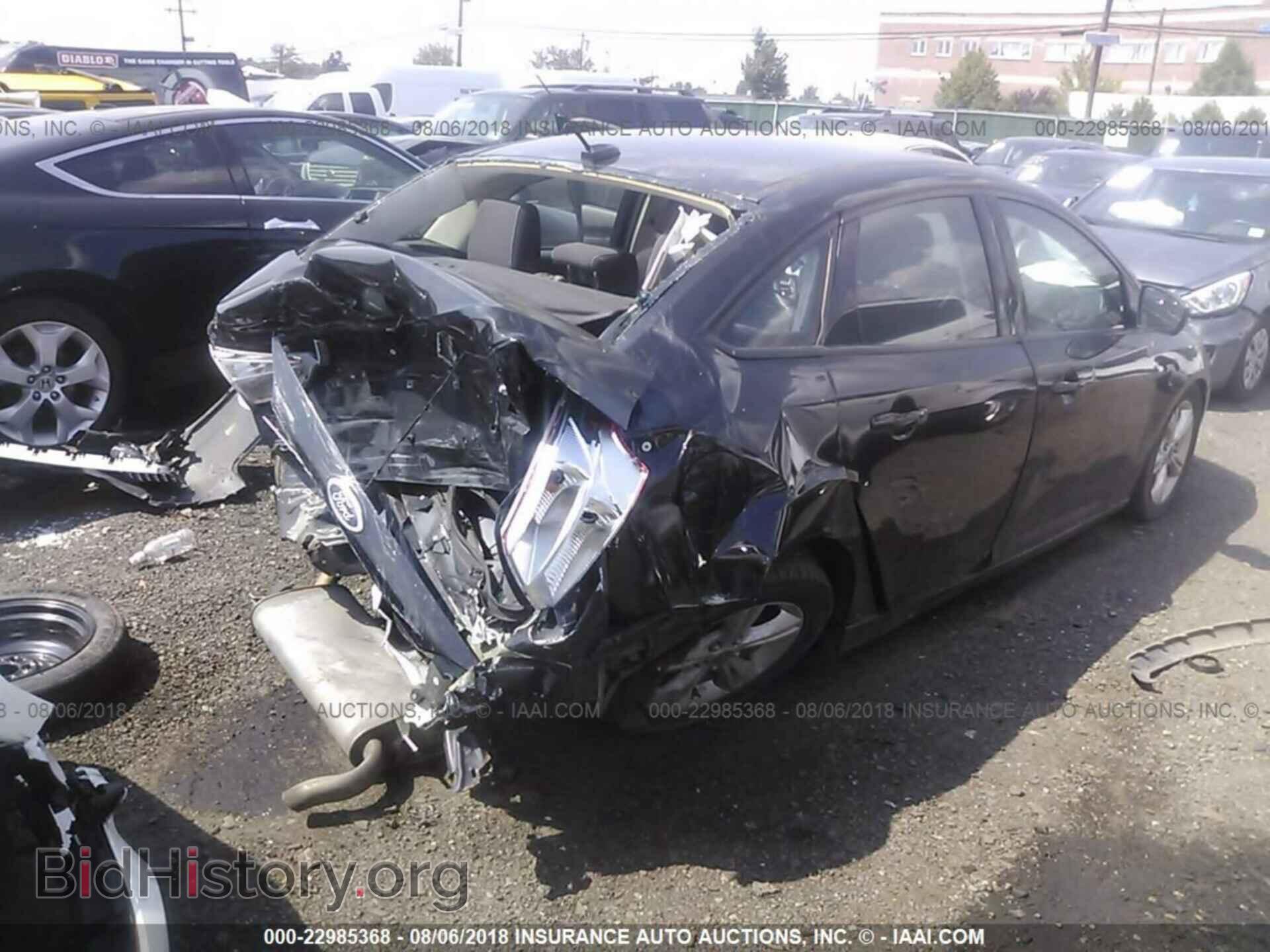 2014 Ford Focus - VIN: 1FADP3F22EL400919 - Фото 4