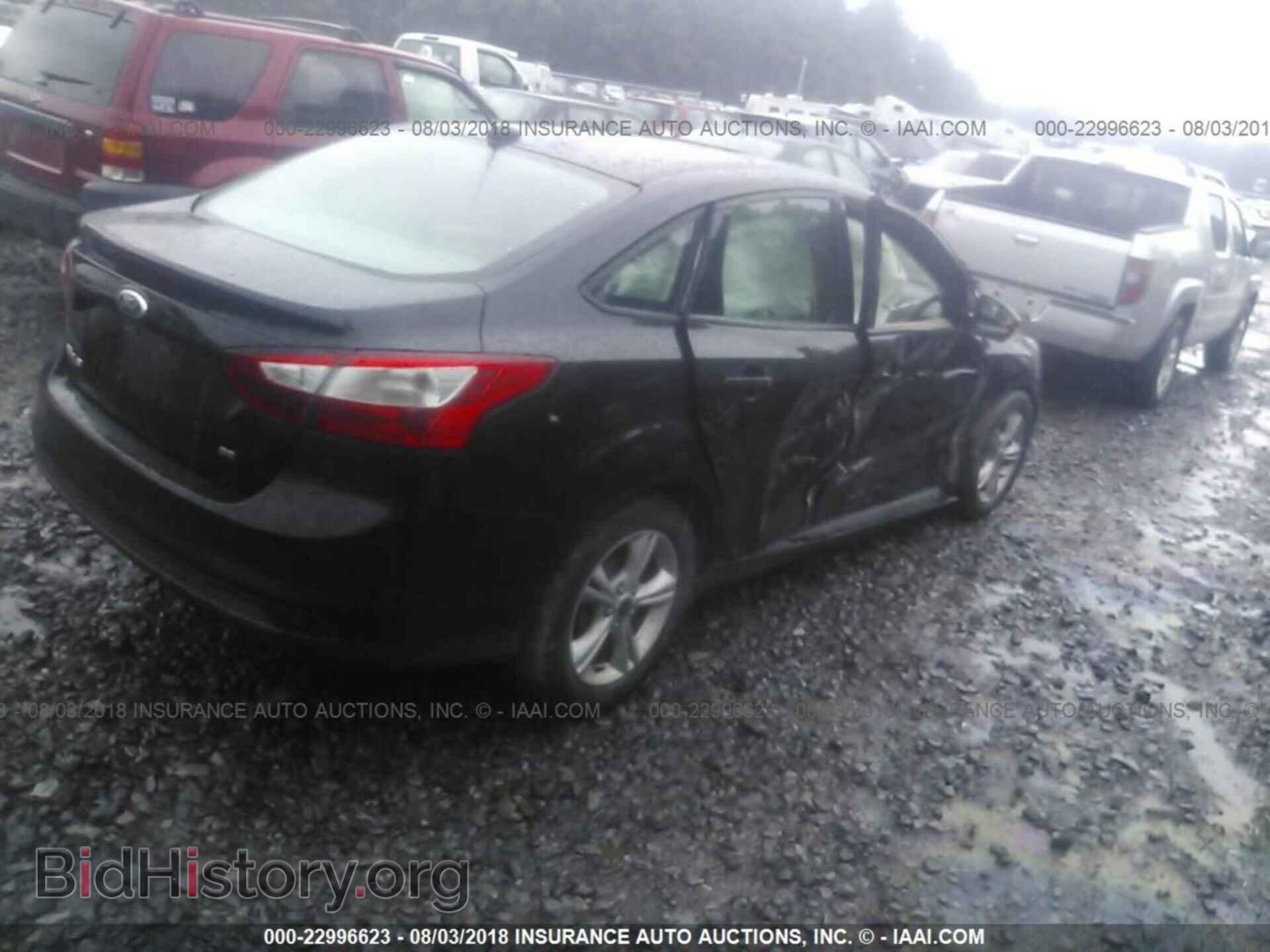 2014 Ford Focus - VIN: 1FADP3F27EL424729 - Photo 4