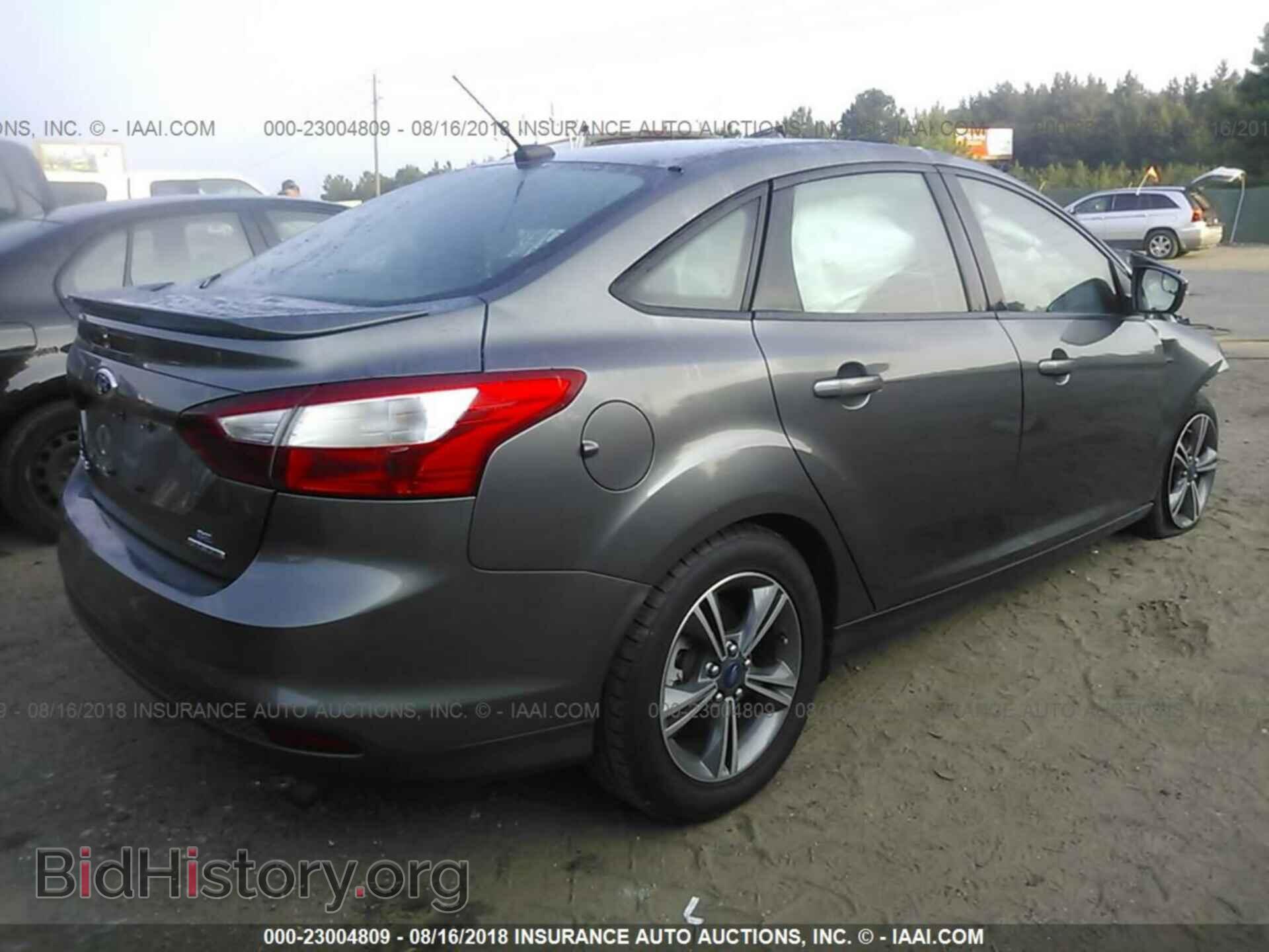 2014 Ford Focus - VIN: 1FADP3F21EL147107 - Фото 4