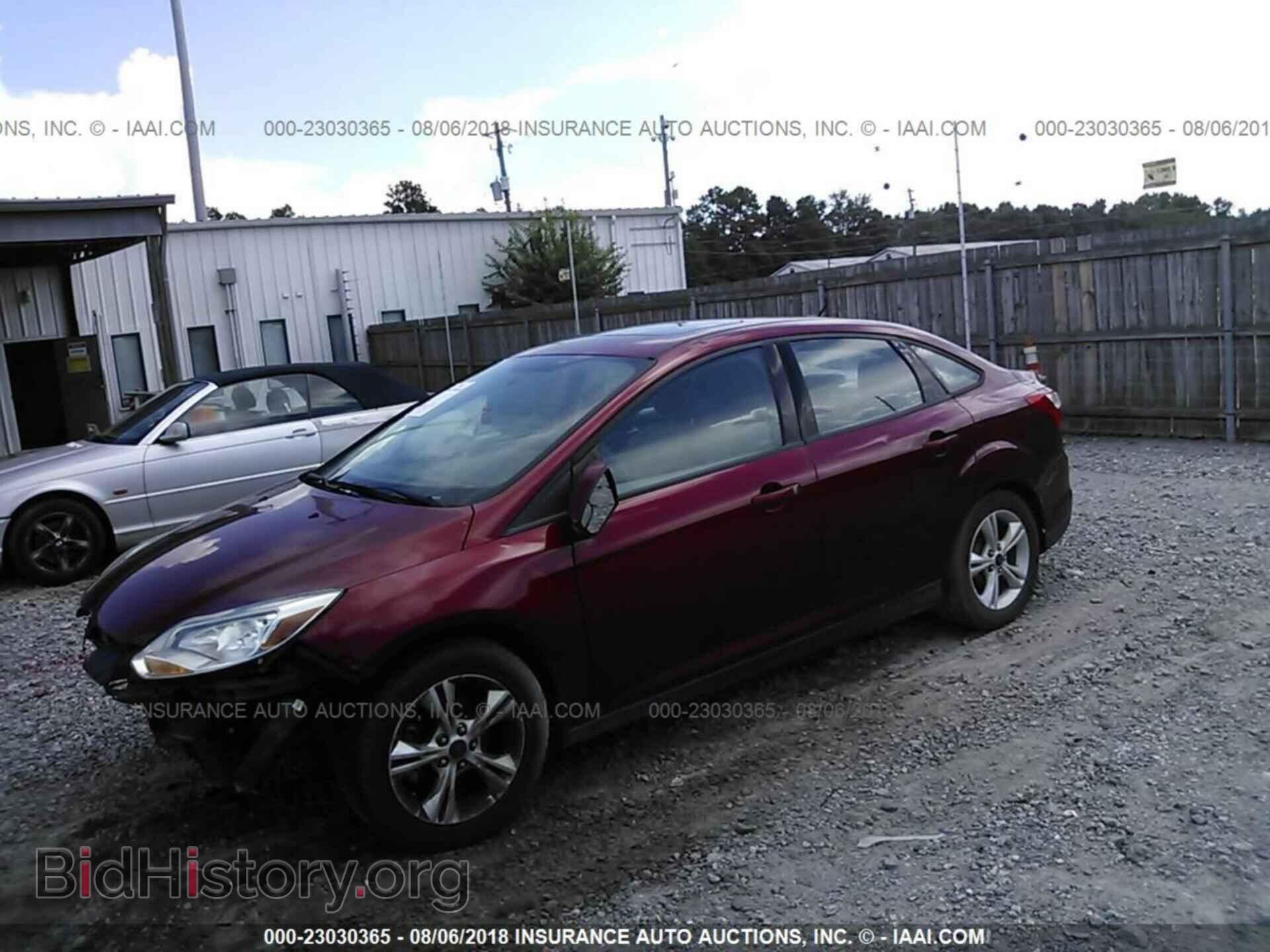 2014 Ford Focus - VIN: 1FADP3F20EL387099 - Фото 2