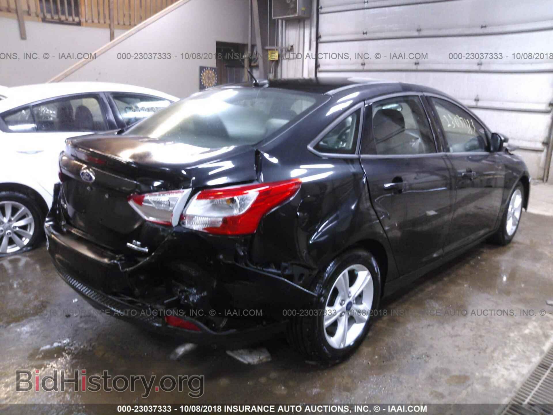 2014 Ford Focus - VIN: 1FADP3F25EL441285 - Фото 4