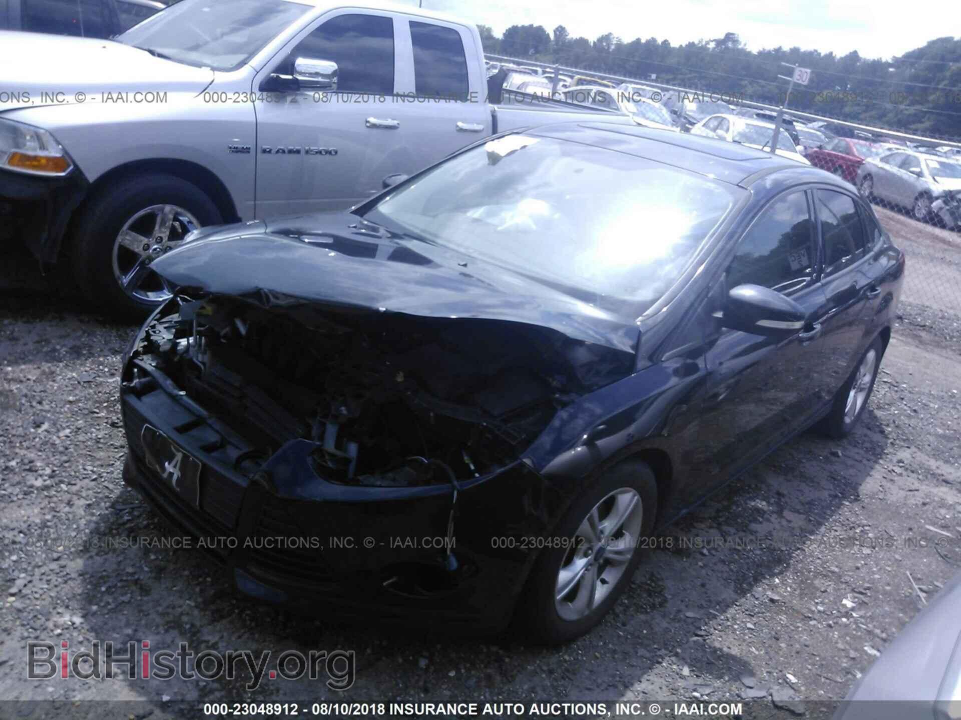 2014 Ford Focus - VIN: 1FADP3F20EL396076 - Фото 2