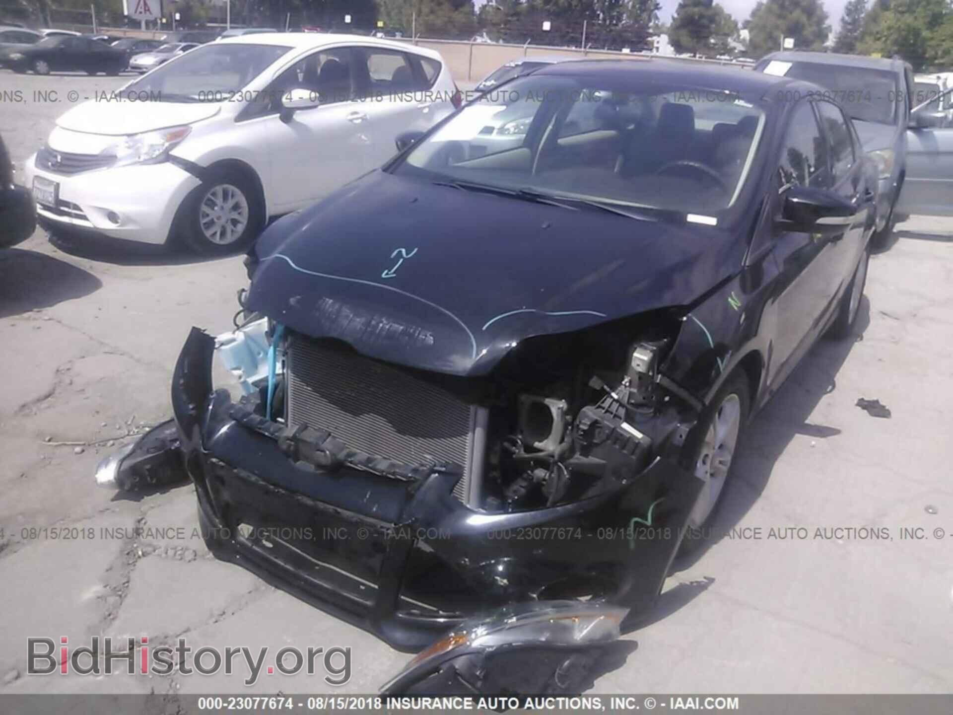 2014 Ford Focus - VIN: 1FADP3F2XEL453402 - Фото 2