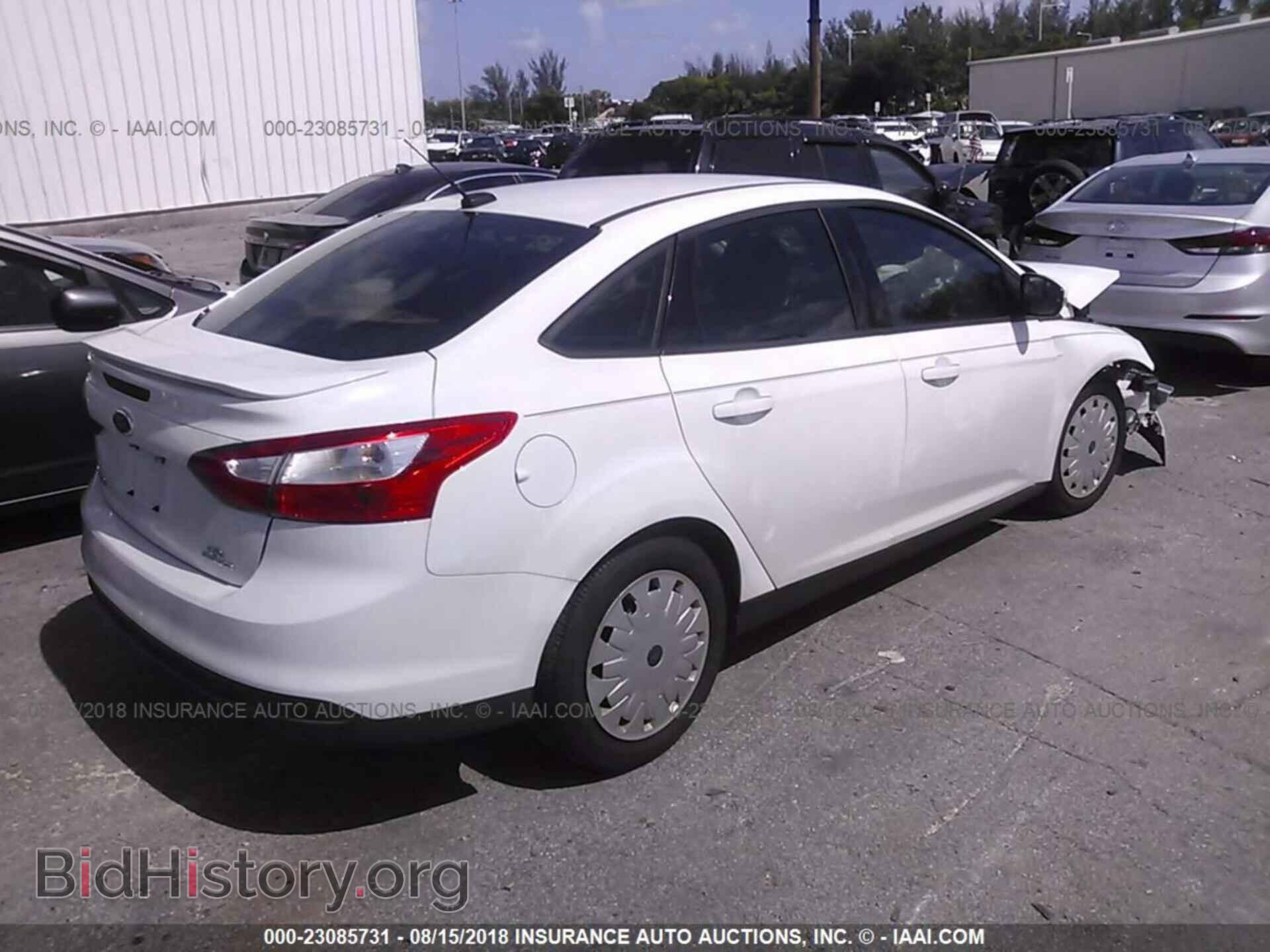 2014 Ford Focus - VIN: 1FADP3F29EL203729 - Фото 4