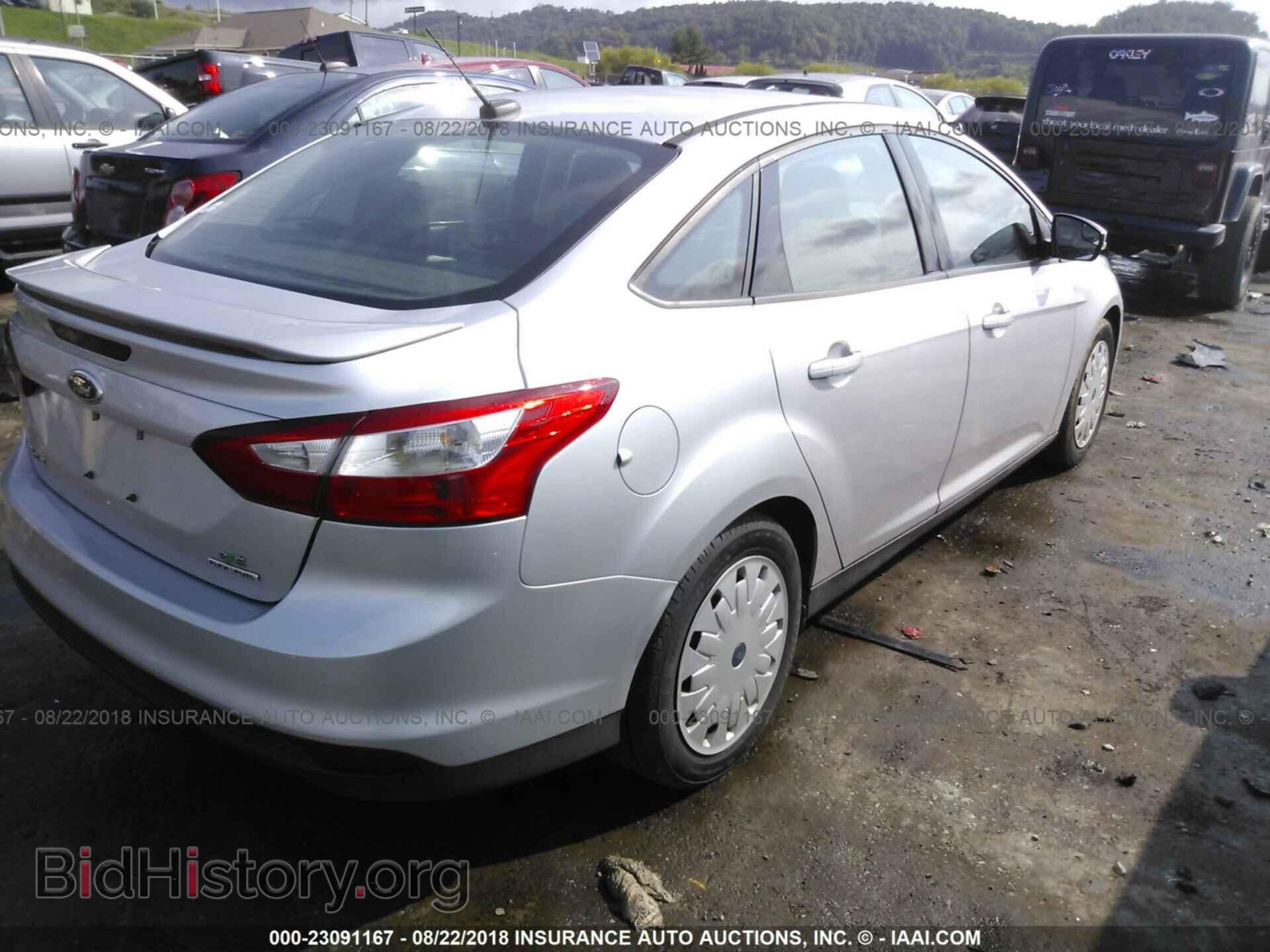 2014 Ford Focus - VIN: 1FADP3F24EL121911 - Фото 4