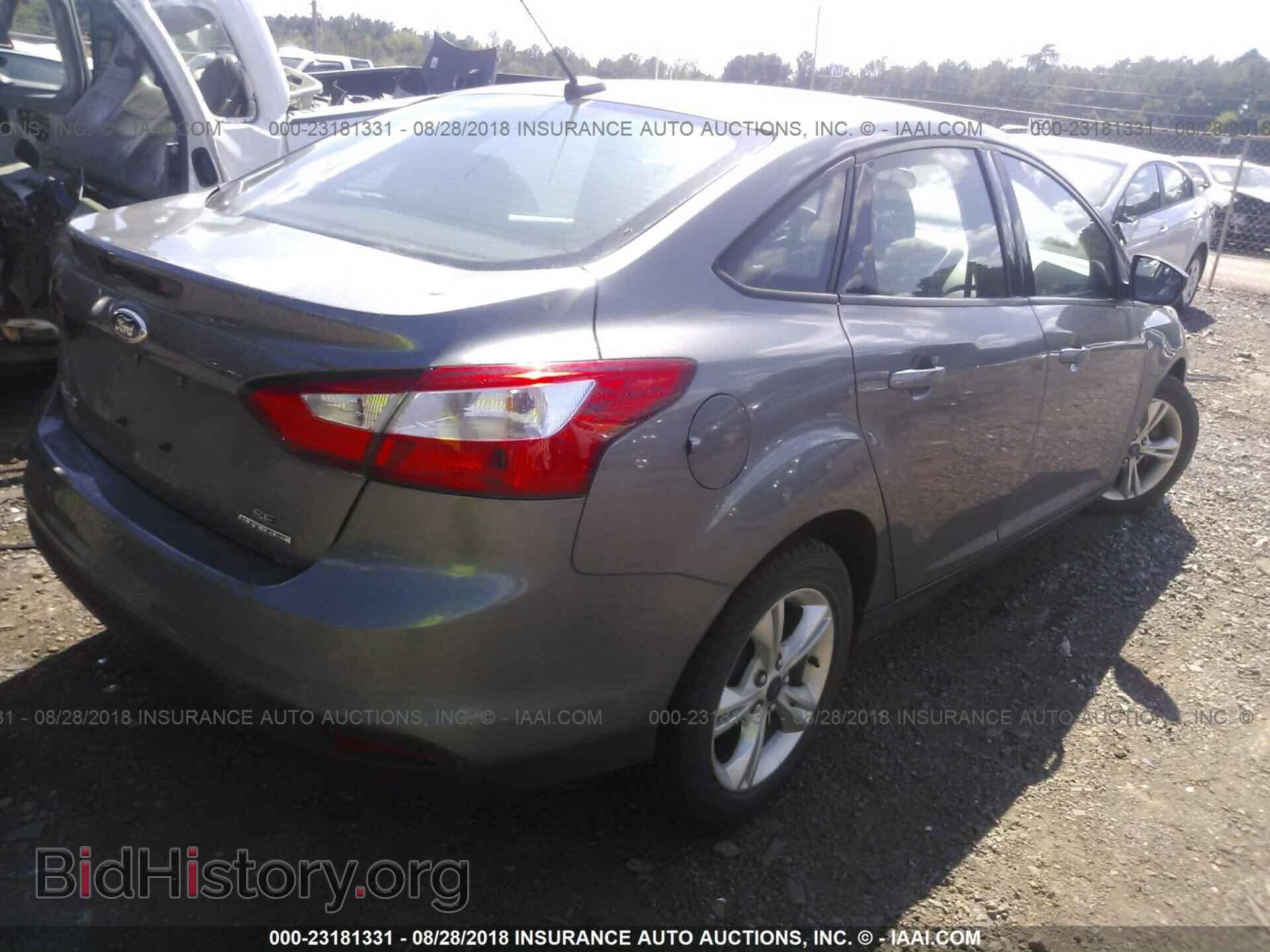 2014 Ford Focus - VIN: 1FADP3F21EL257641 - Фото 4