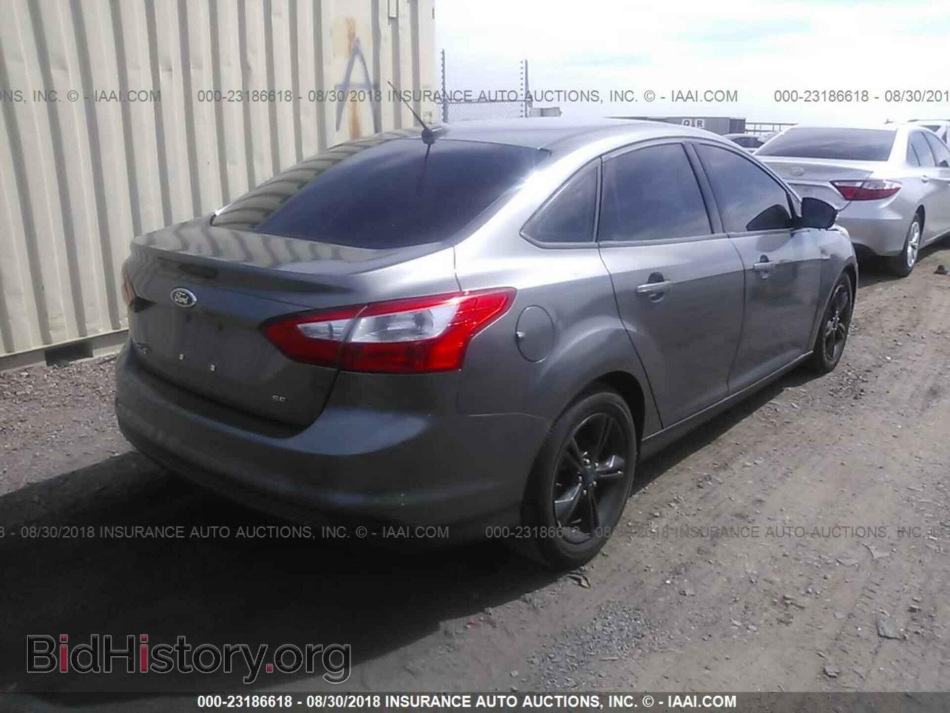 2014 Ford Focus - VIN: 1FADP3F29EL319366 - Фото 4
