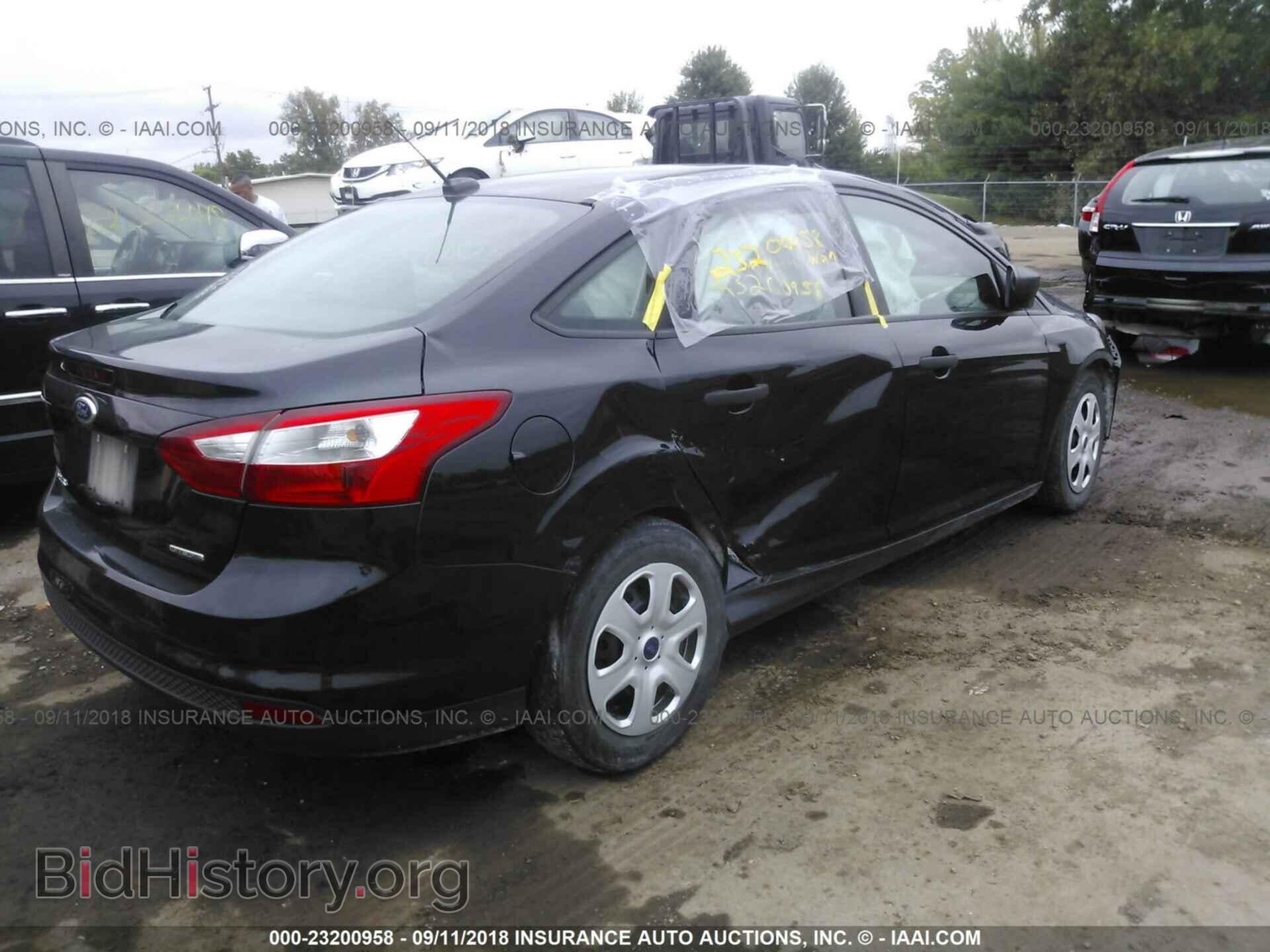 2014 Ford Focus - VIN: 1FADP3E23EL310521 - Фото 4