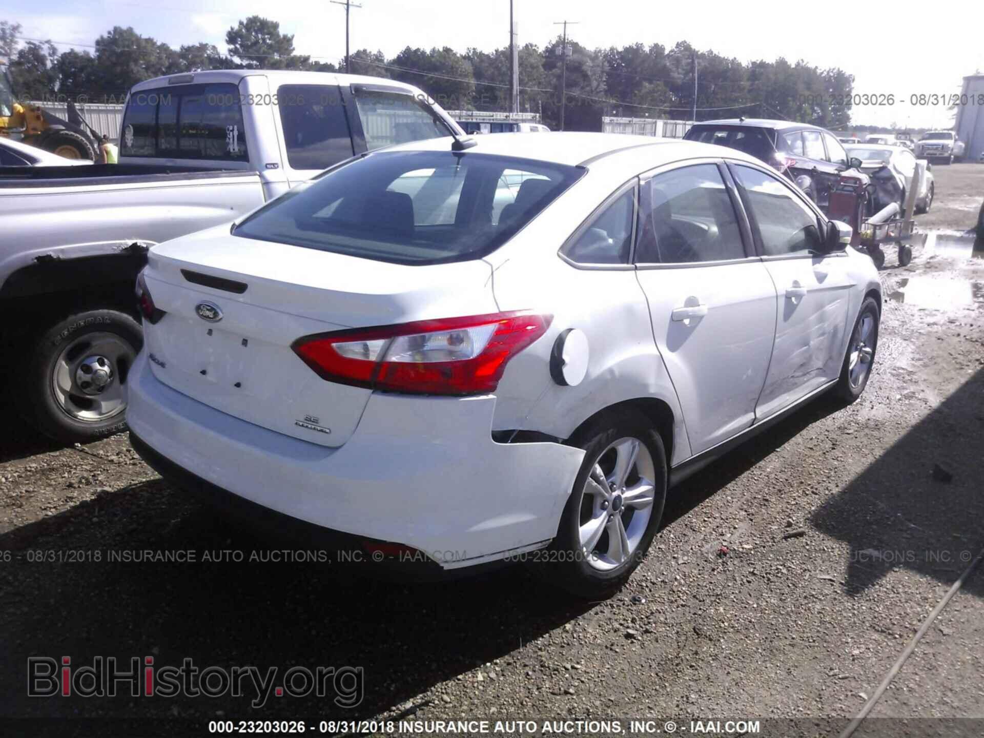 2014 Ford Focus - VIN: 1FADP3F24EL277835 - Фото 4