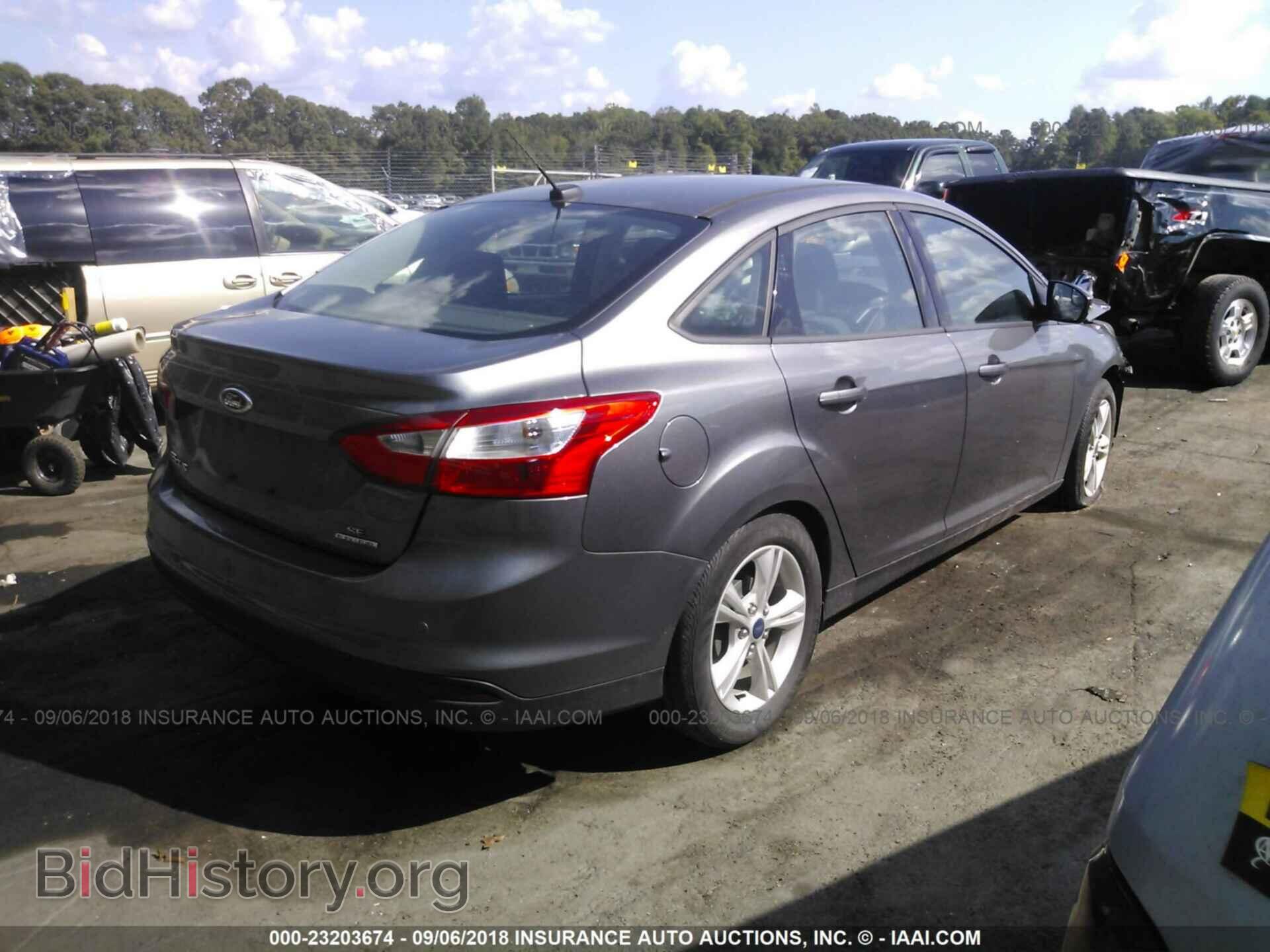 2014 Ford Focus - VIN: 1FADP3F22EL421611 - Photo 4