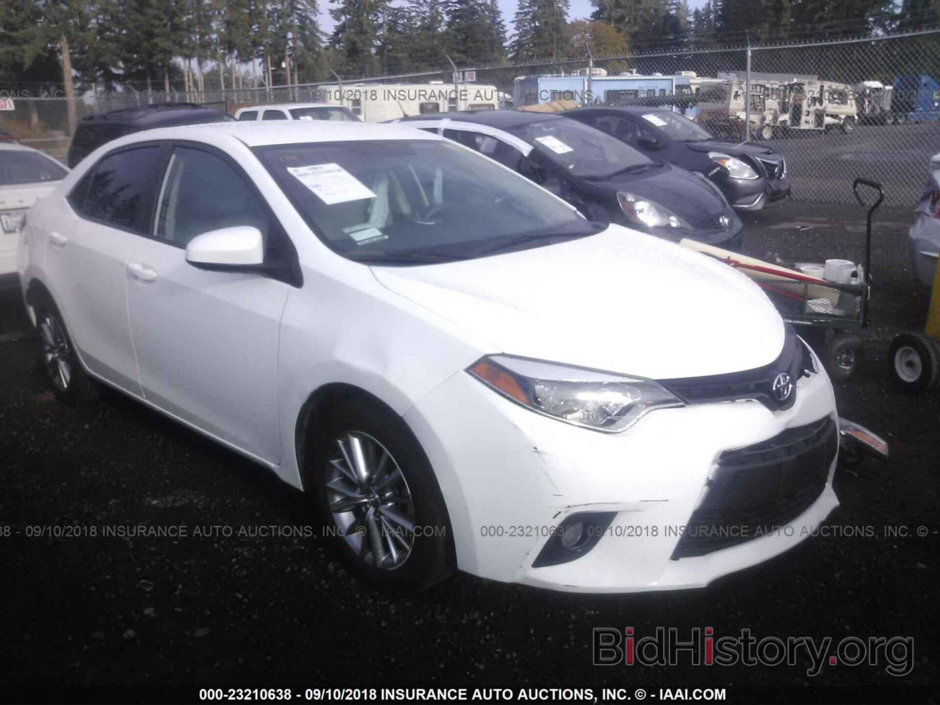 Photo 5YFBURHE8EP165485 - Toyota Corolla 2014