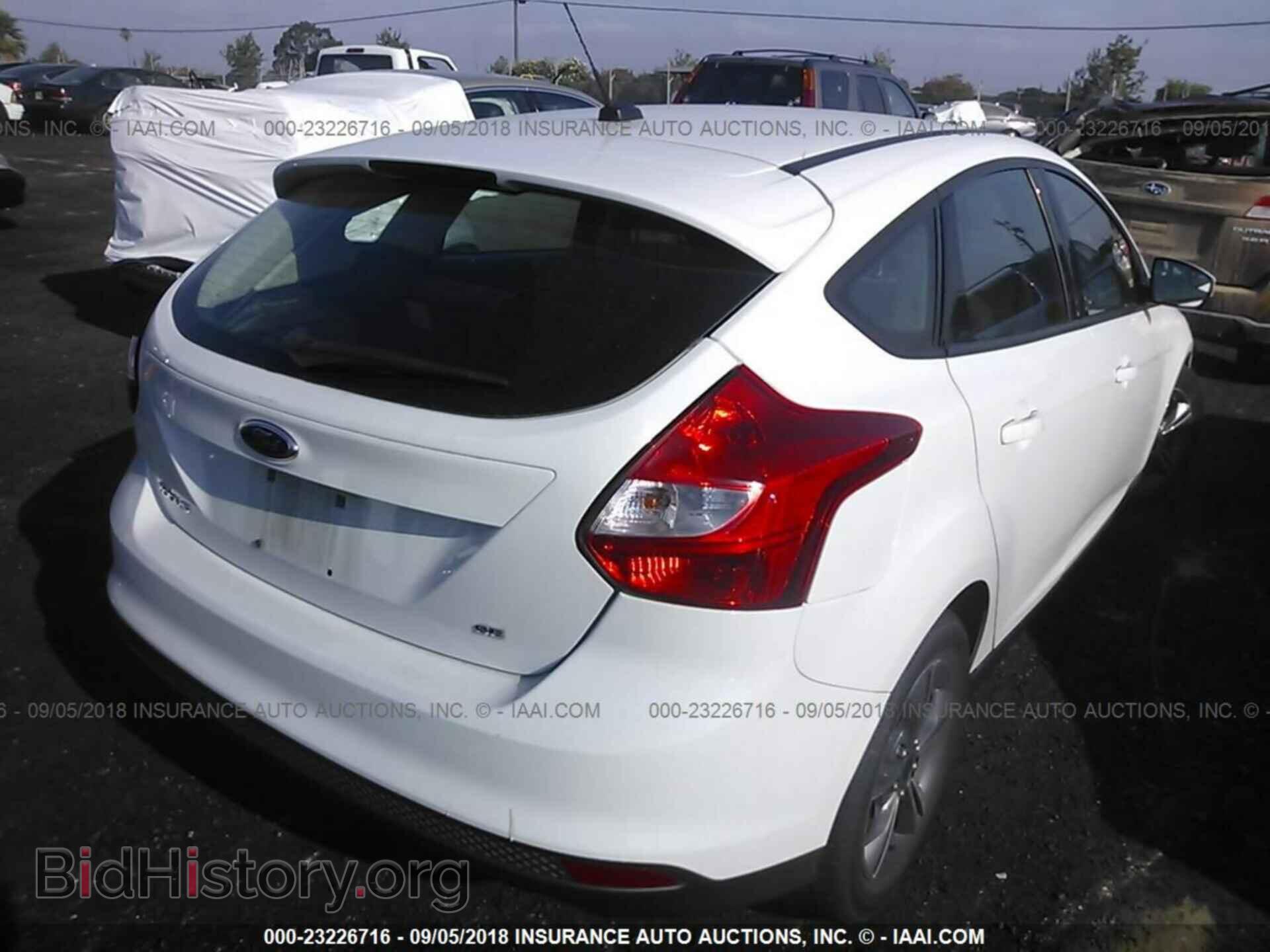 2014 Ford Focus - VIN: 1FADP3K28EL317310 - Photo 4