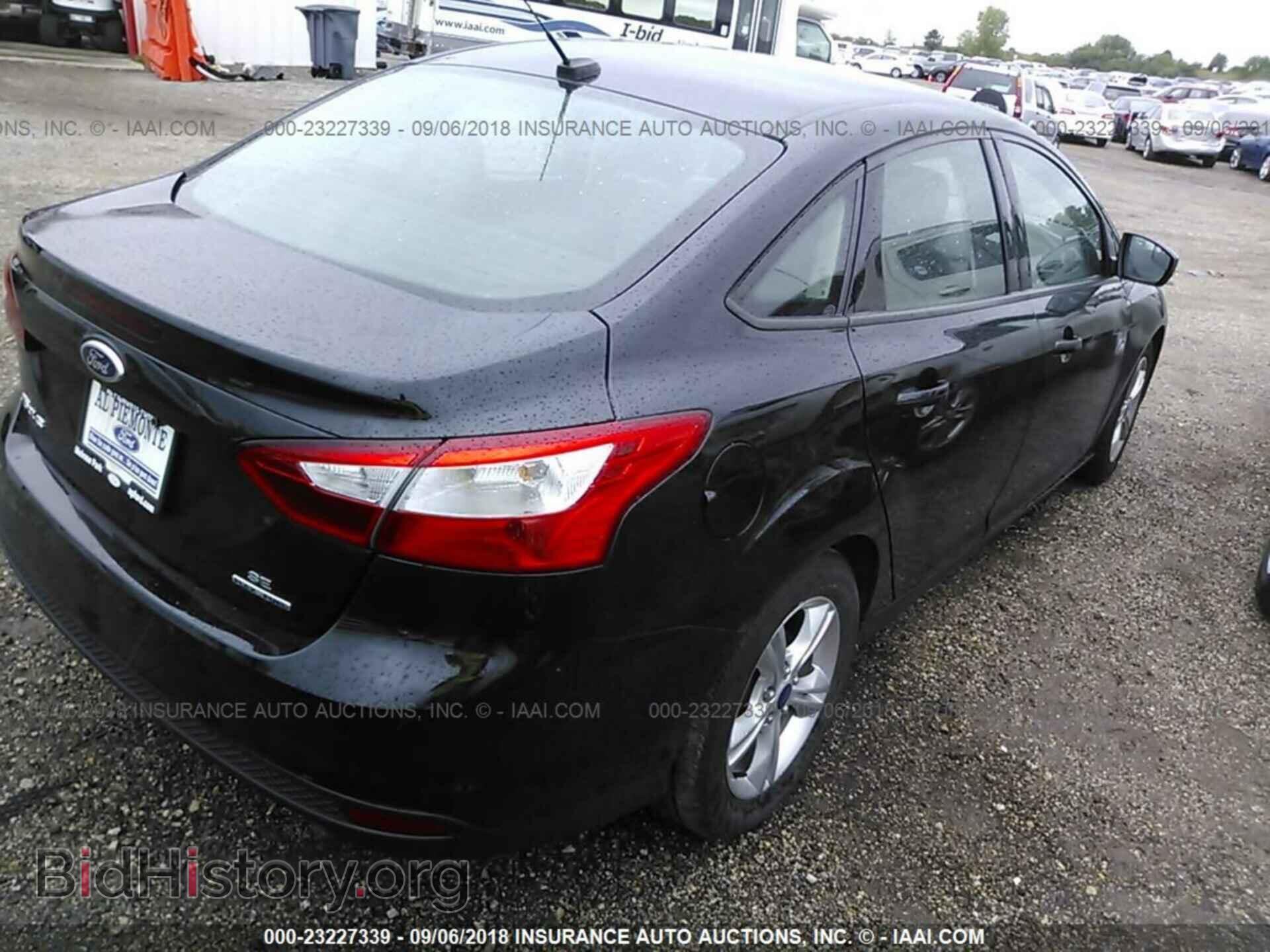 2014 Ford Focus - VIN: 1FADP3F26EL216793 - Фото 4