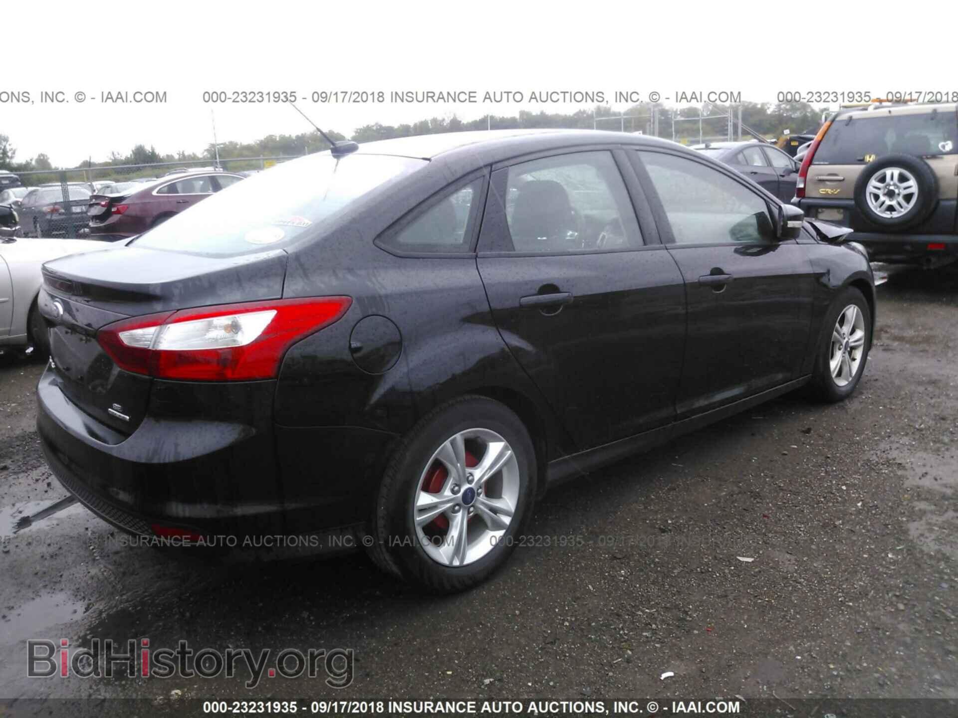 2014 Ford Focus - VIN: 1FADP3F23EL293007 - Фото 4