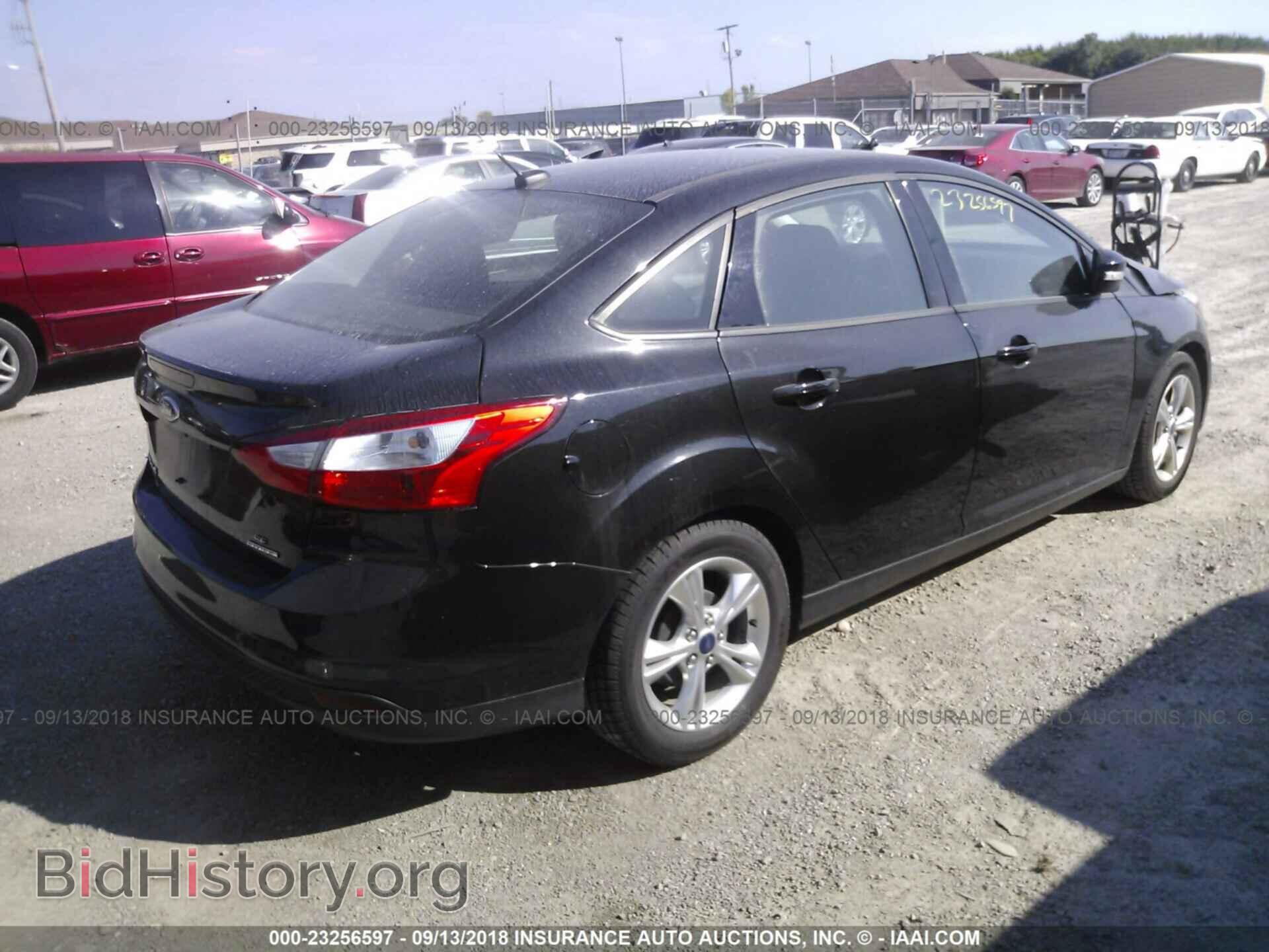 2014 Ford Focus - VIN: 1FADP3F21EL258322 - Photo 4